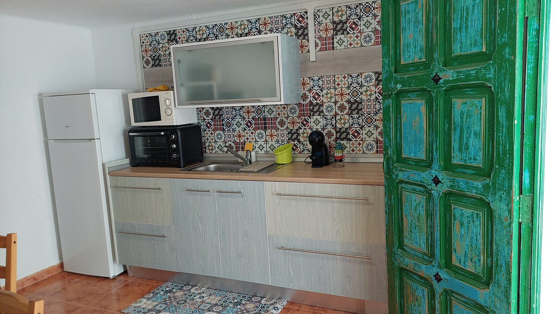 Kitchen with fridge and cabinets