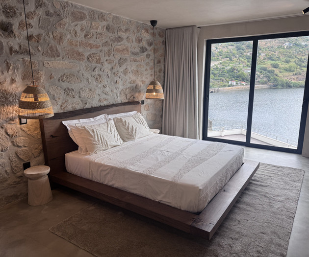 Bedroom with balcony river view