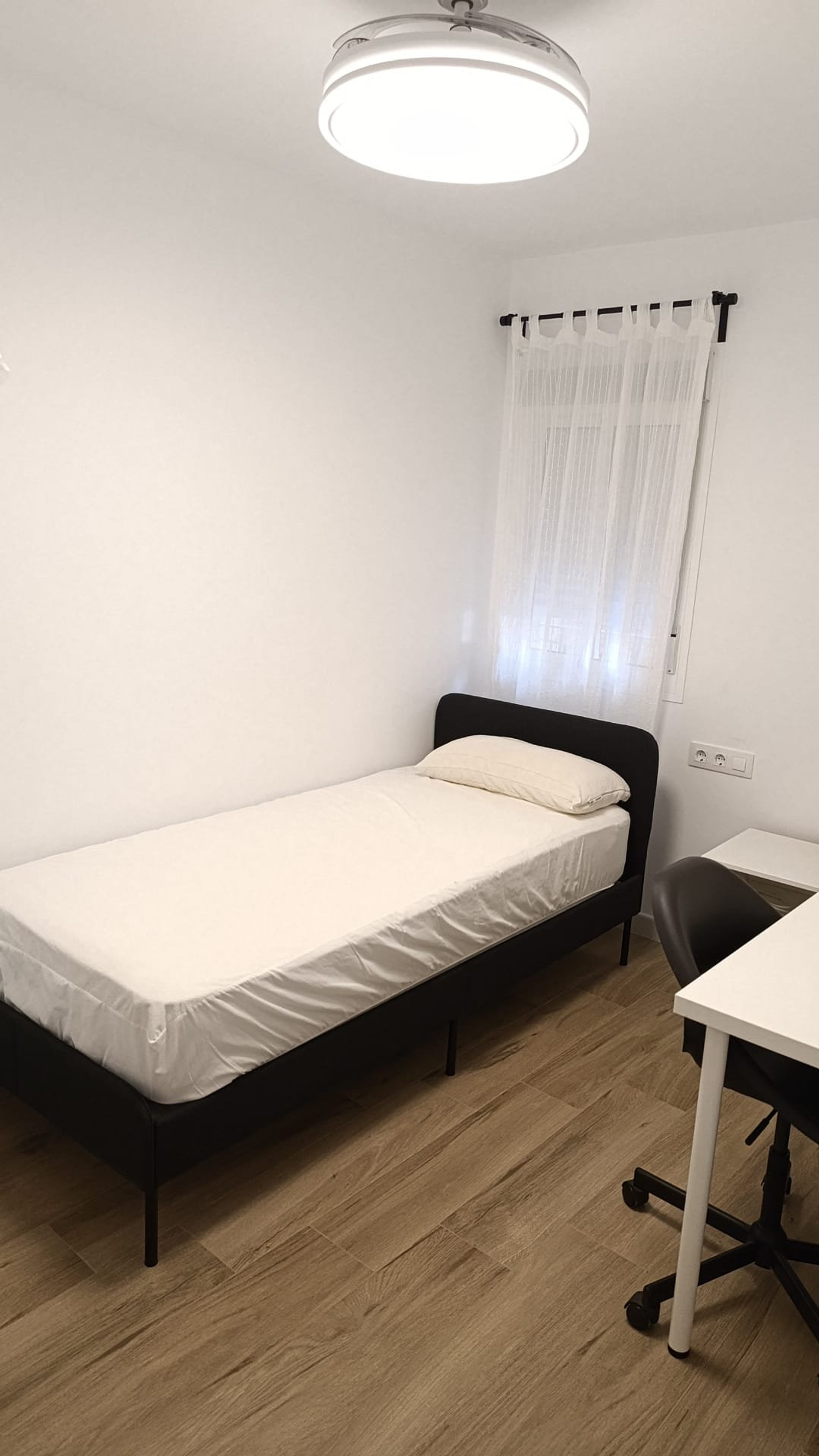 Bright bedroom with desk area