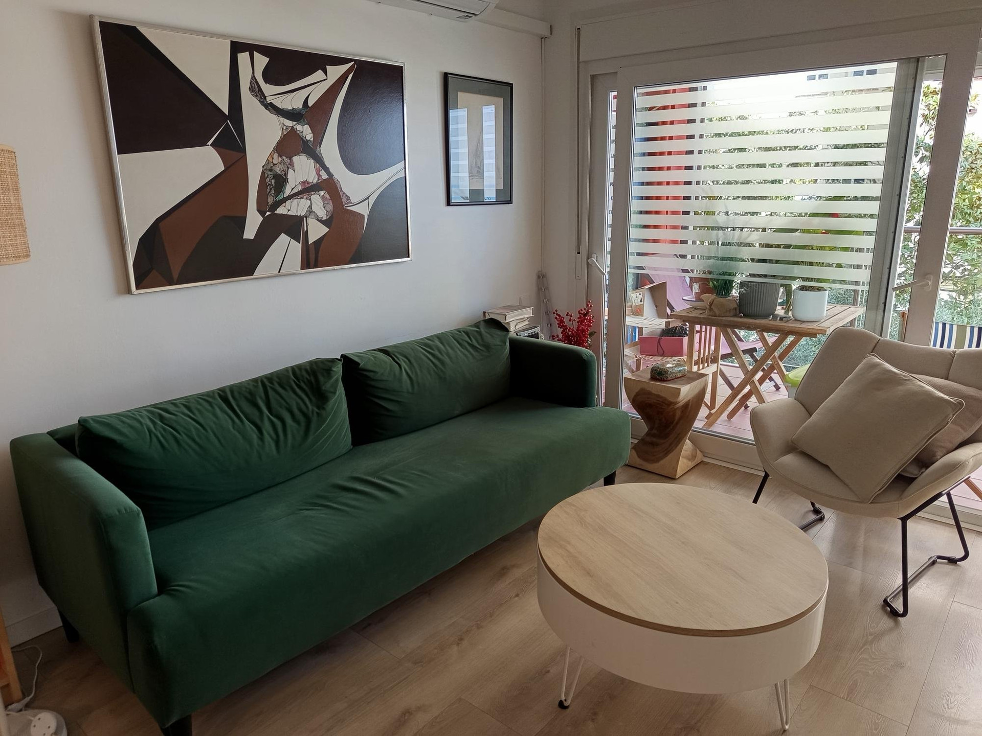 Living room green sofa balcony view