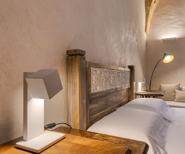 Bedside lamp and carved headboard