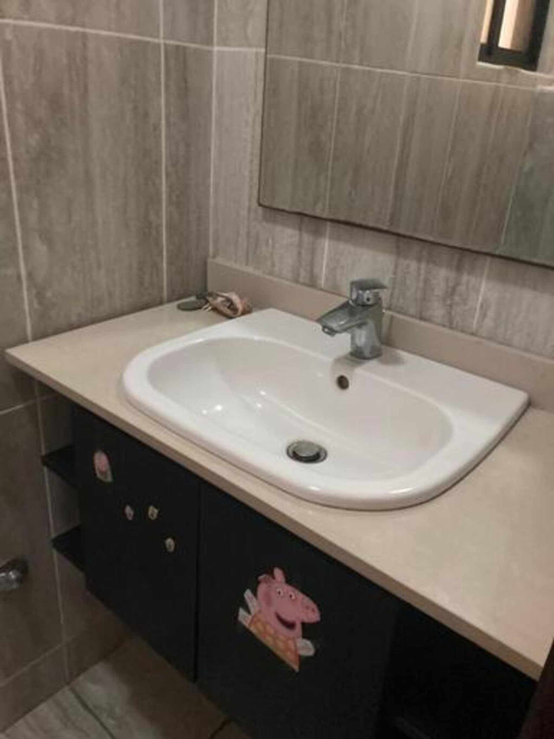 Bathroom / Wash Area The bathroom includes a clean and modern wash hand basin area, a well fitted shower, and quality fixtures, ensuring comfort and functionality.