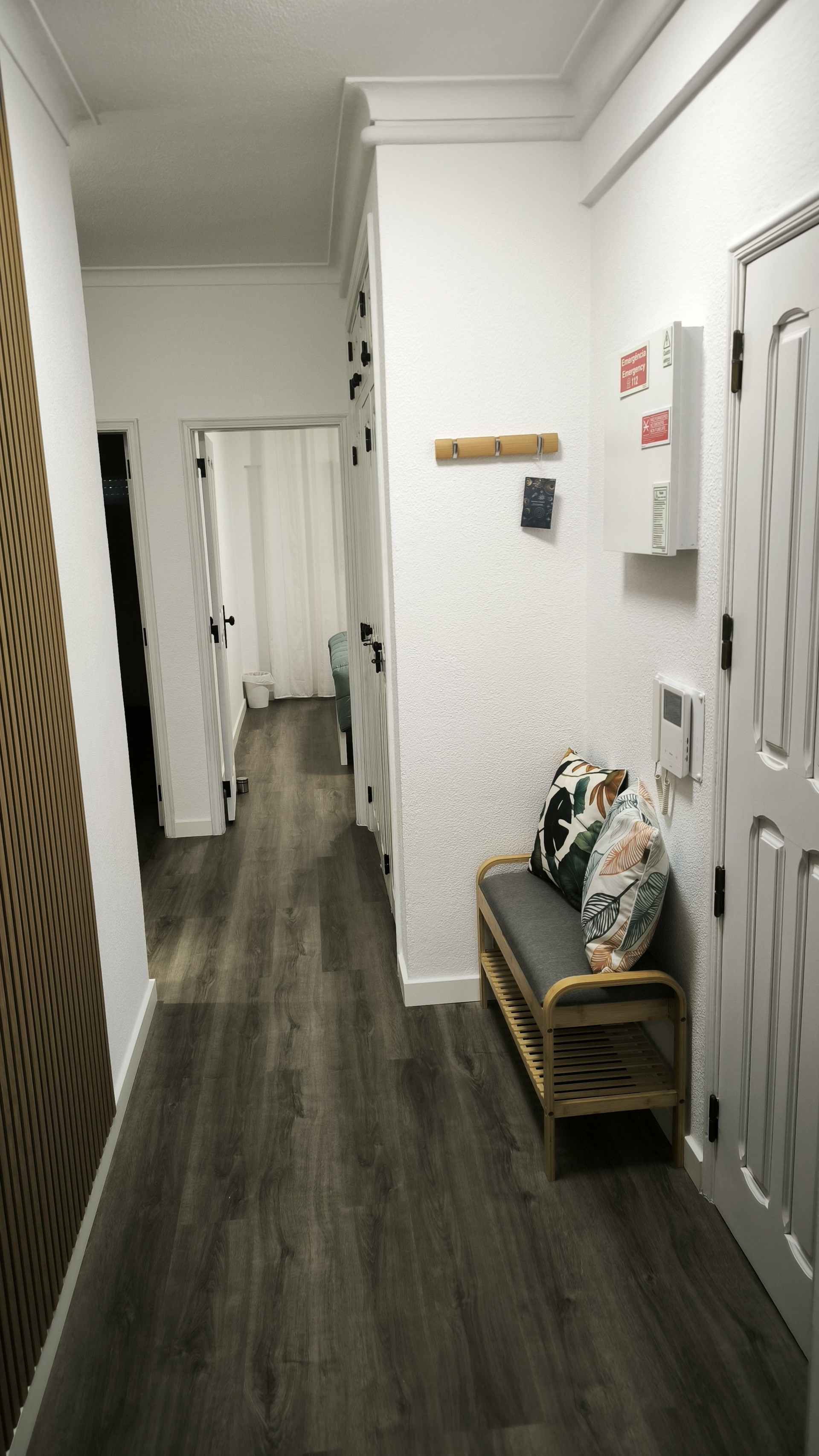 Hallway with bench and doors