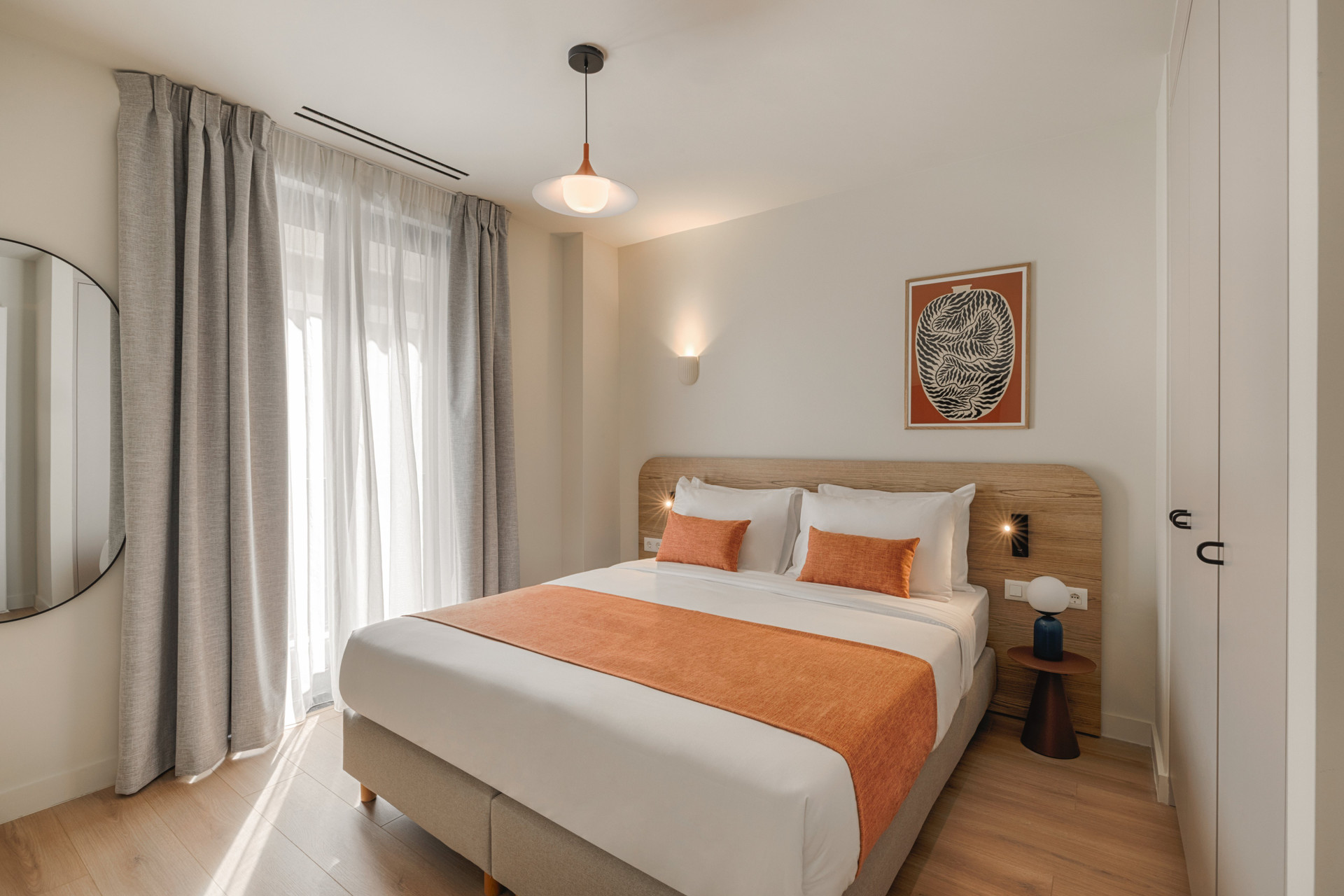 Bright bedroom with wooden headboard