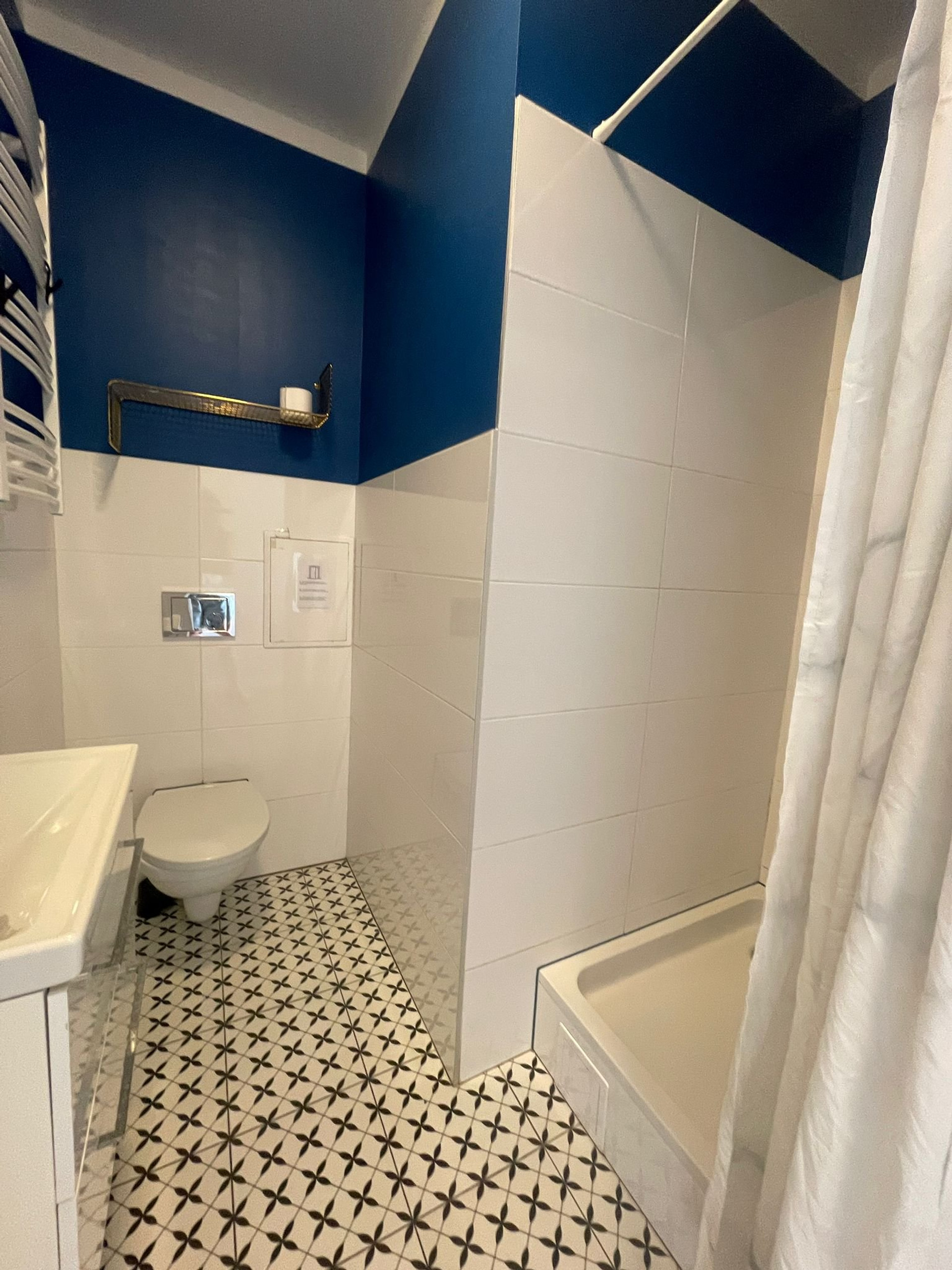 Blue and white bathroom with shower