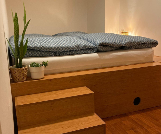 Raised sleeping platform with steps