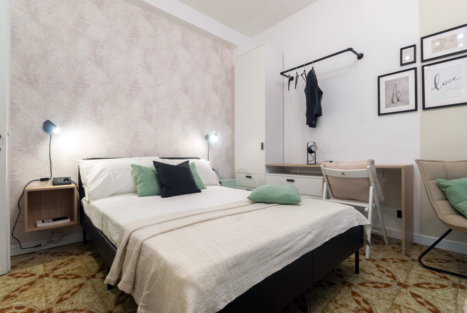 Double bed with floral accent wall