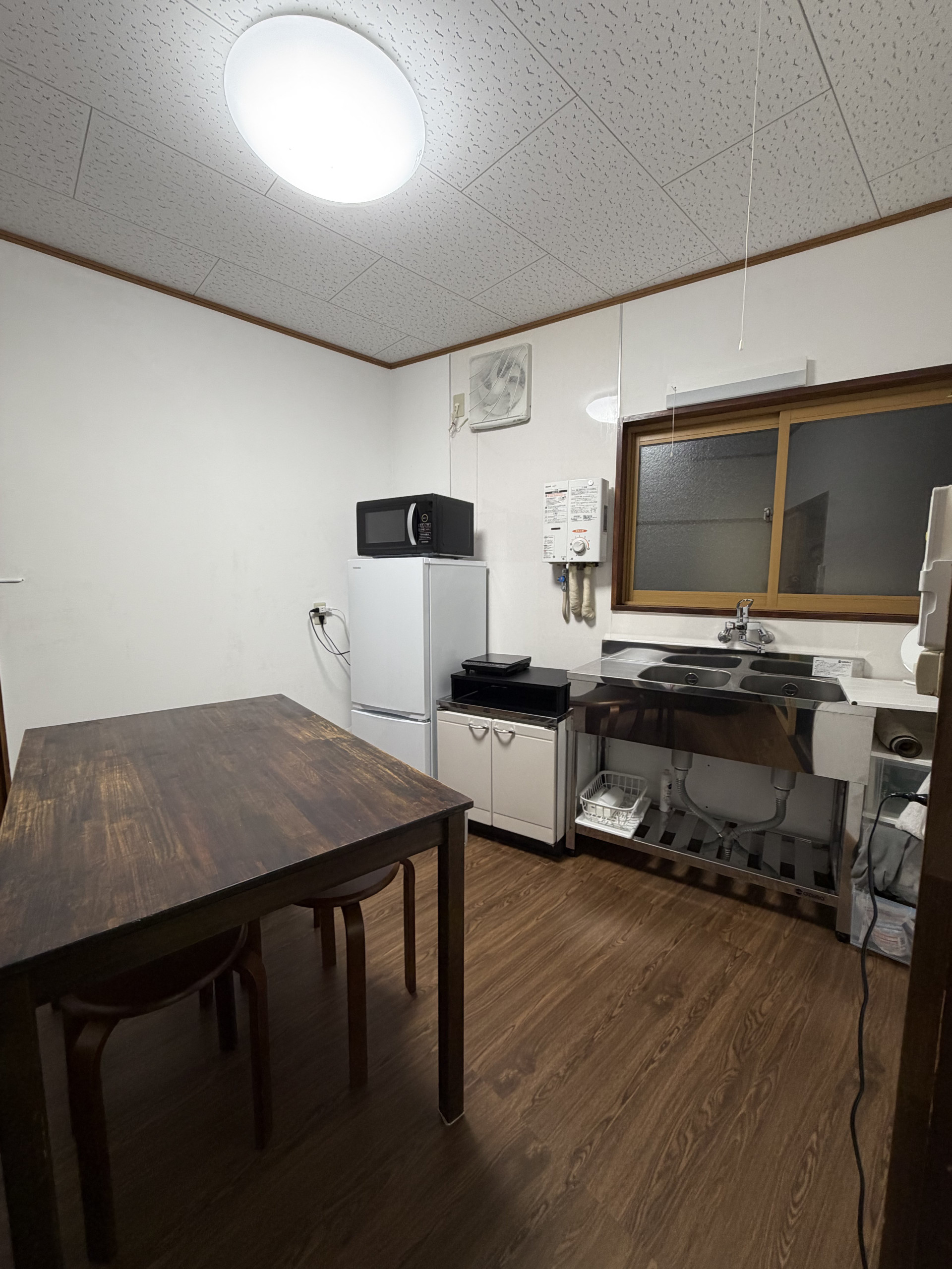Kitchen with dining table and appliances