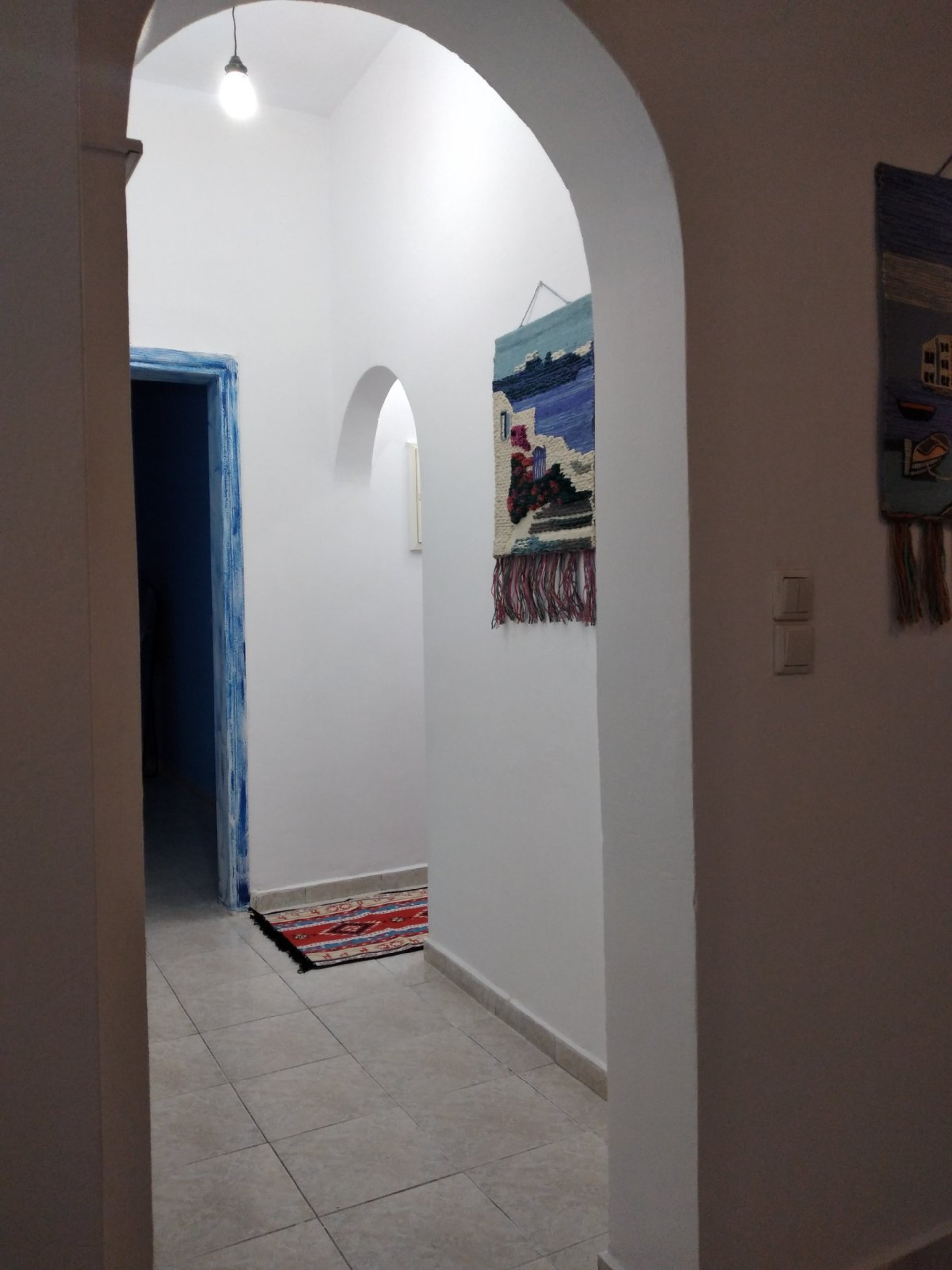 Arched hallway with decorative walls