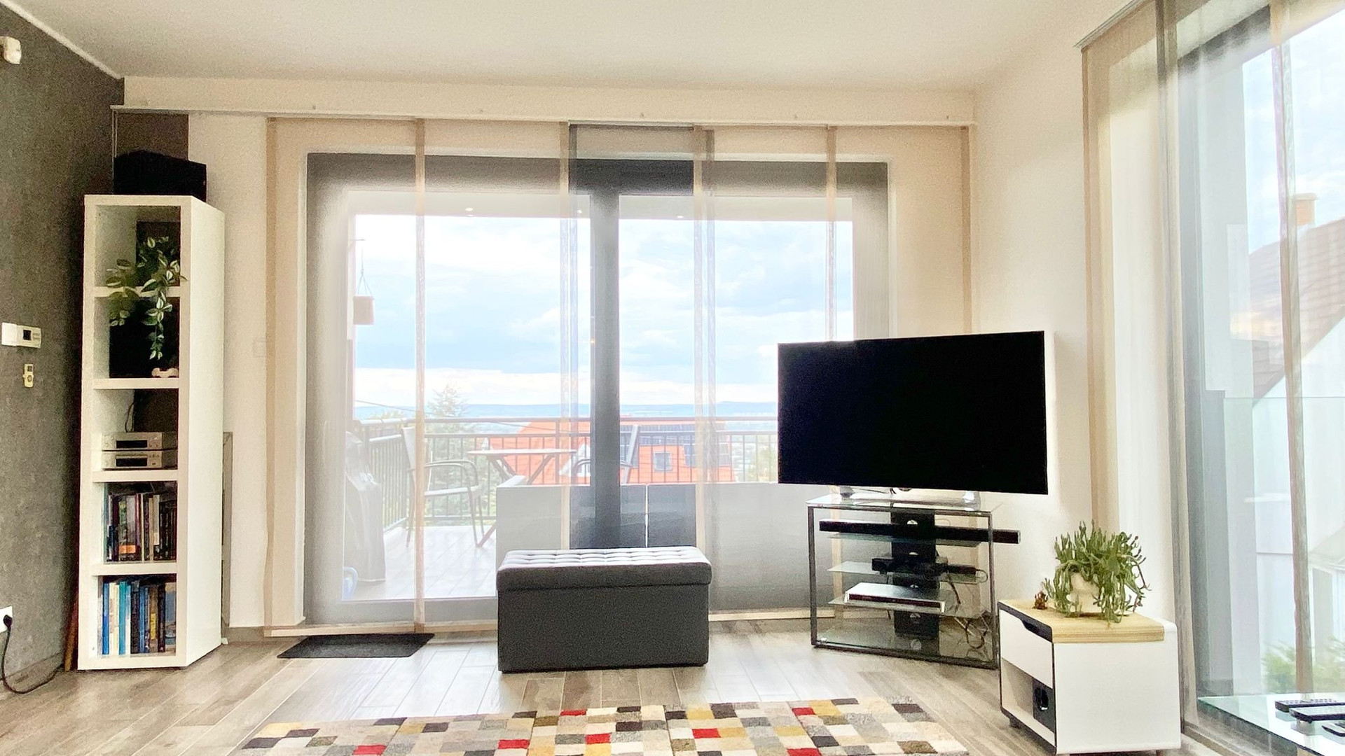 Living area with TV and balcony