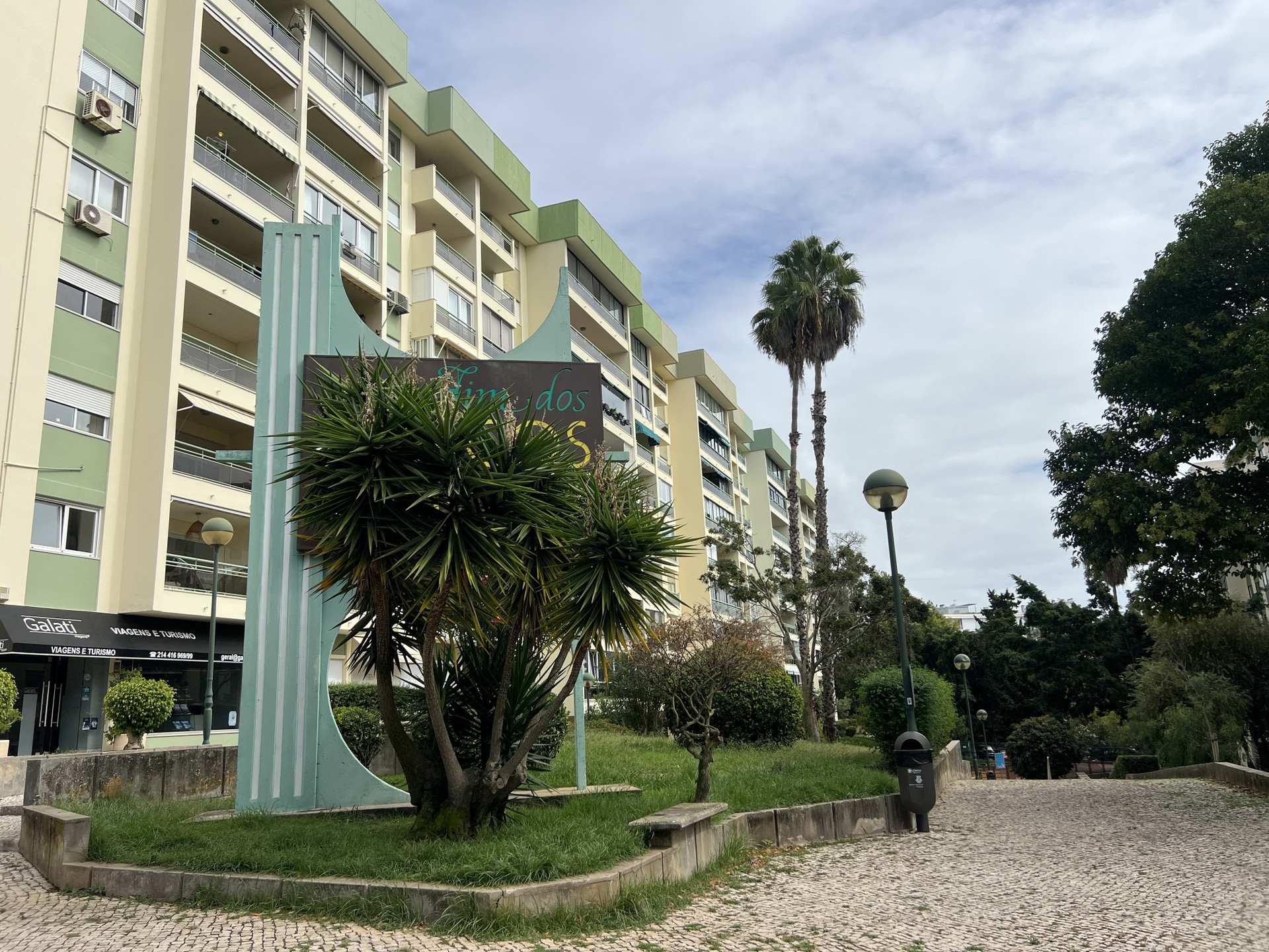 Apartment building exterior with landscaped entrance