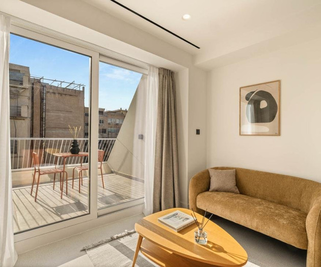 Sofa area with balcony access