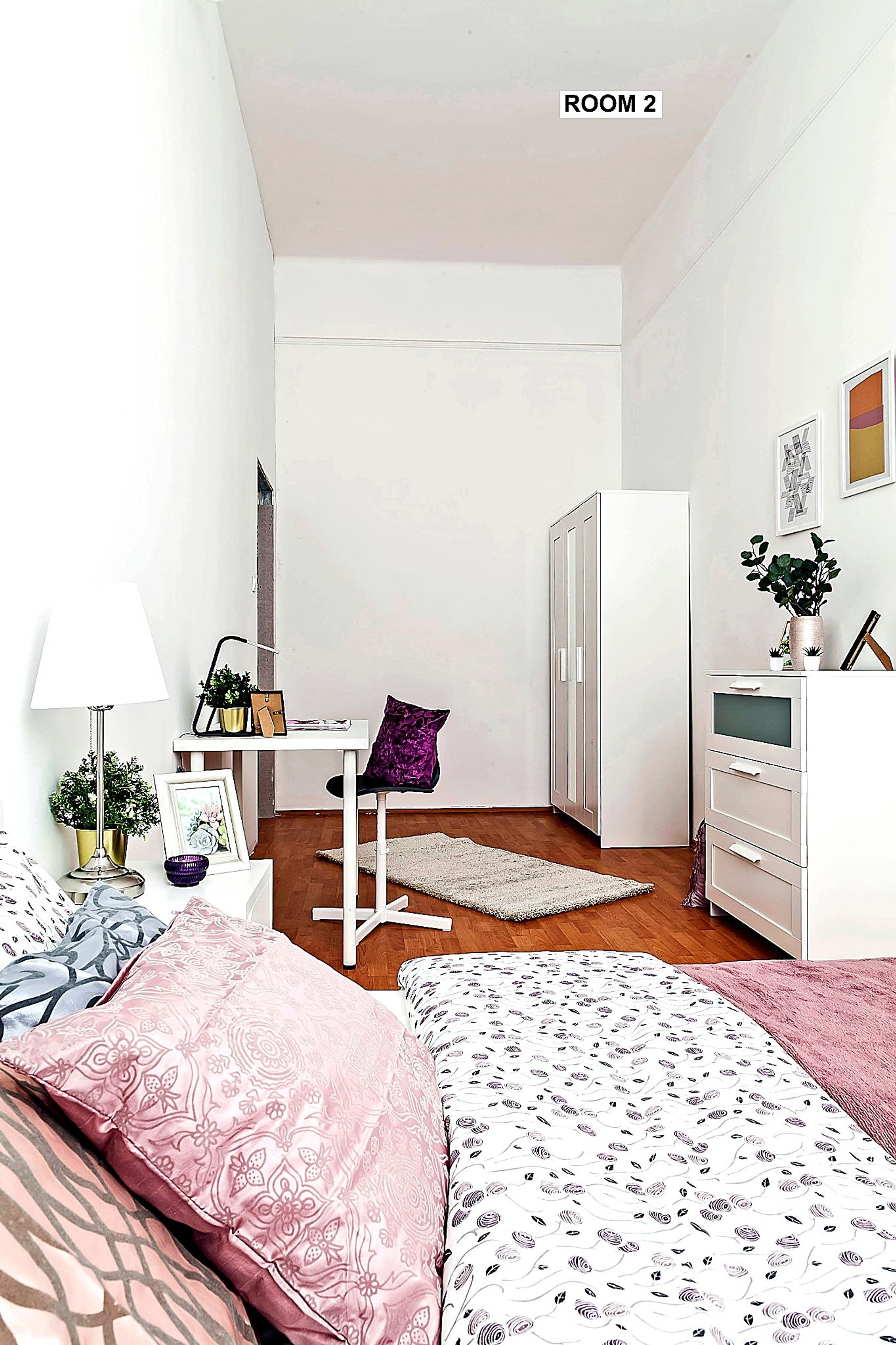 View from the bed highlighting the spacious interior, functional workspace, wardrobe and storage solutions available for long-term comfort.