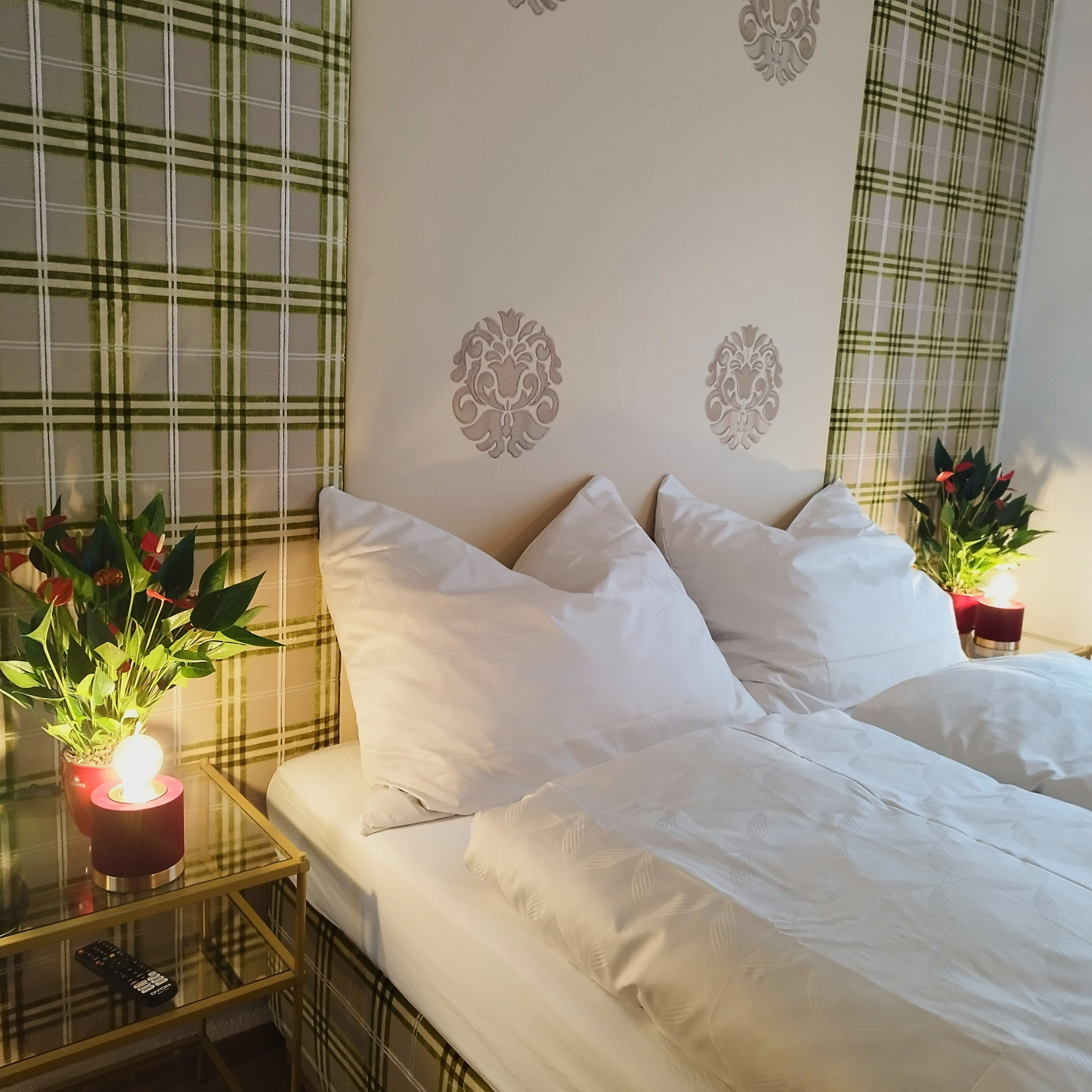 Cozy bed with plants and lamps
