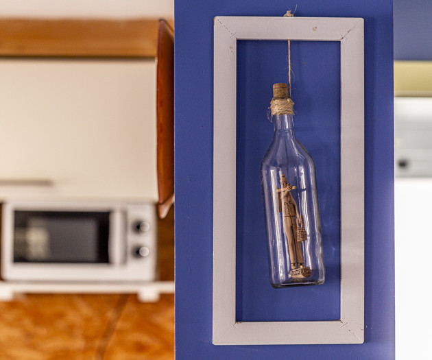 Decorative bottle art in frame