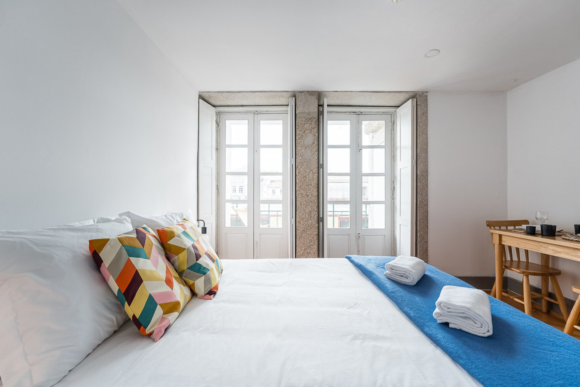 Bedroom with double doors and table