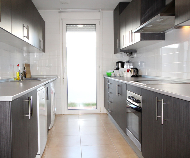 Galley kitchen with laundry area