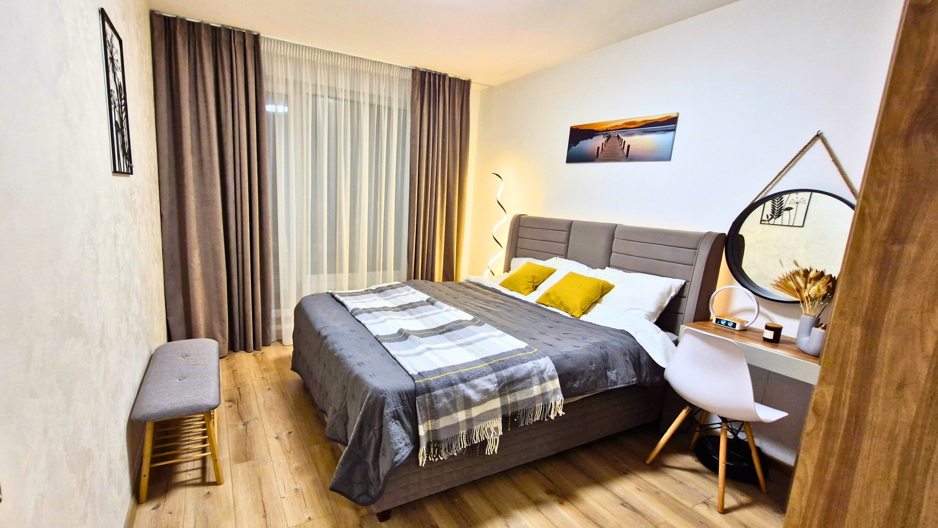 Bedroom with curtains and dressing table