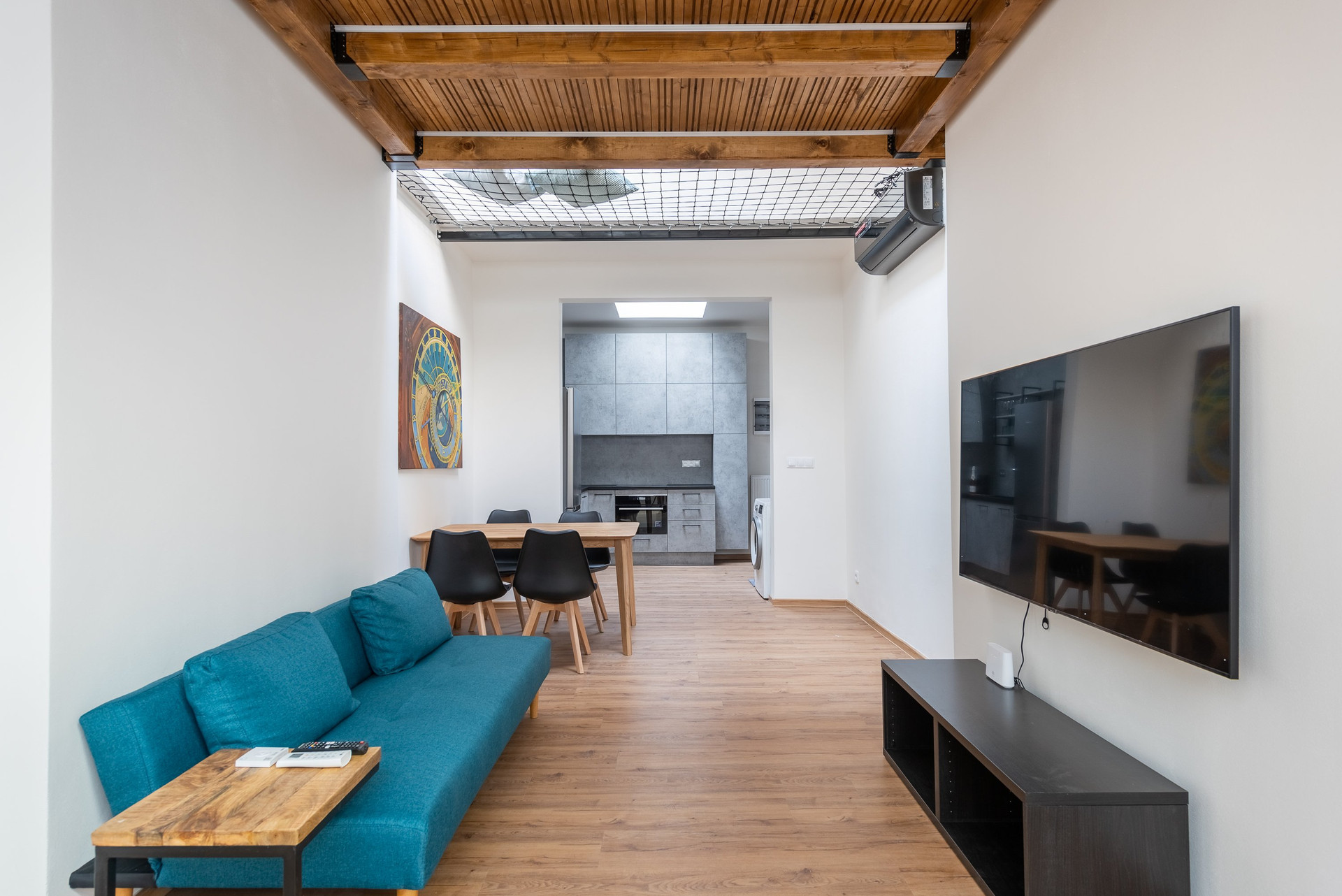 Living room sofa with kitchen view