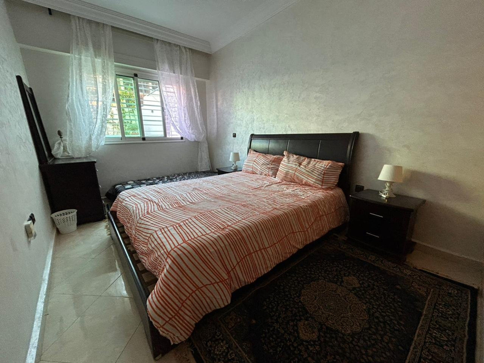 Bedroom with striped bedding