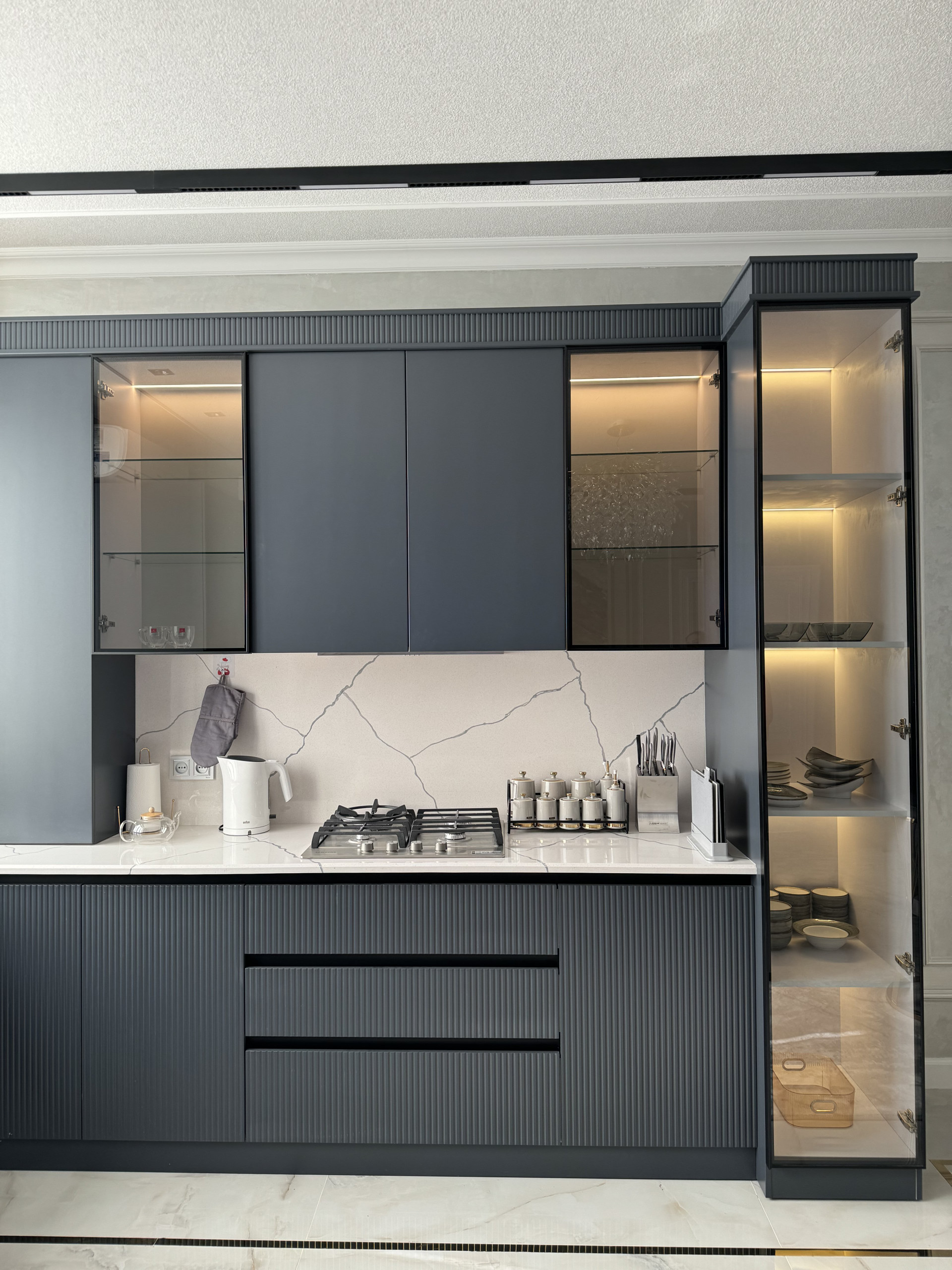 Fully equipped kitchen with stove, fridge, microwave, and all necessary cookware.”