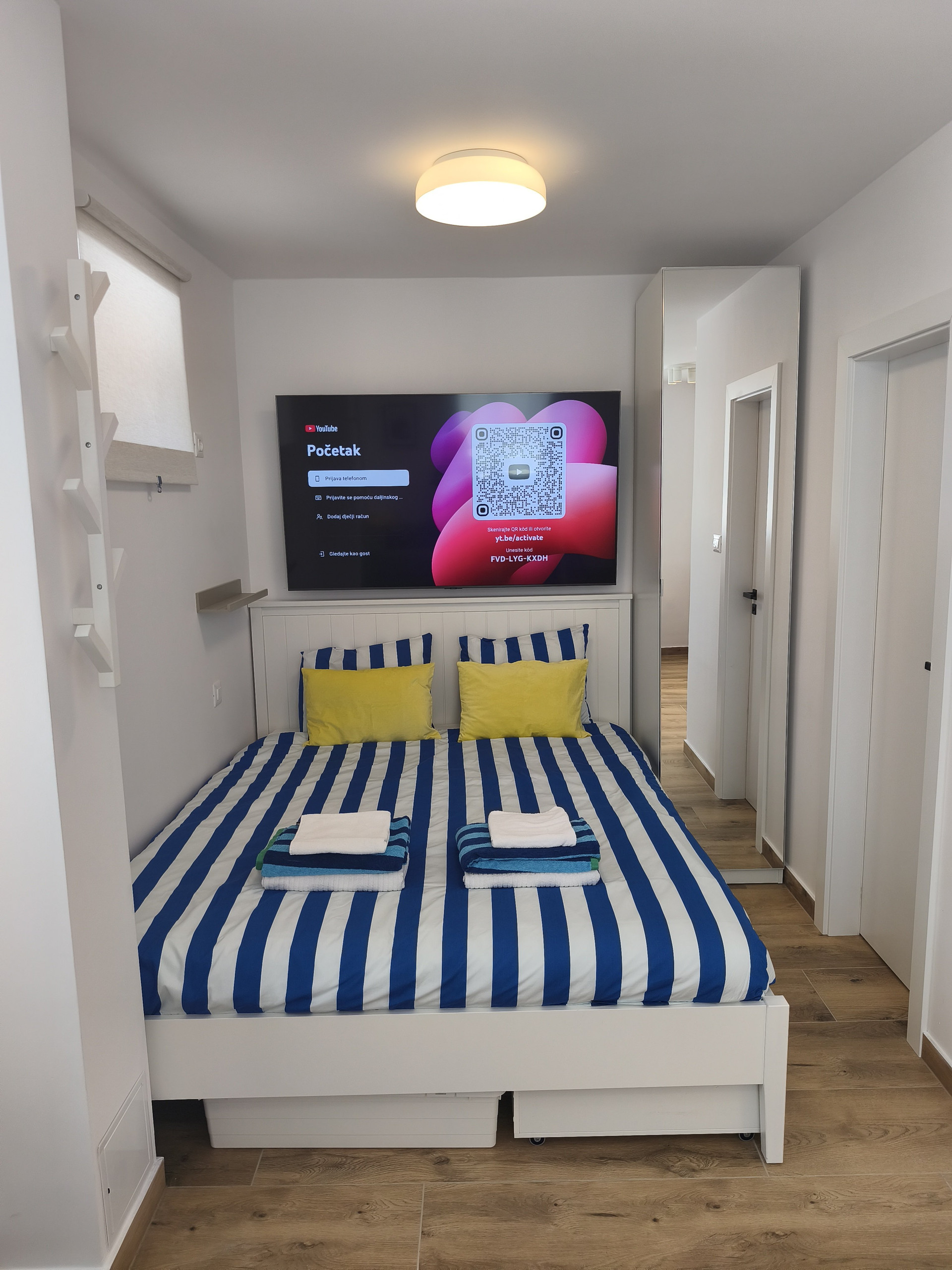 Bedroom with double bed and TV