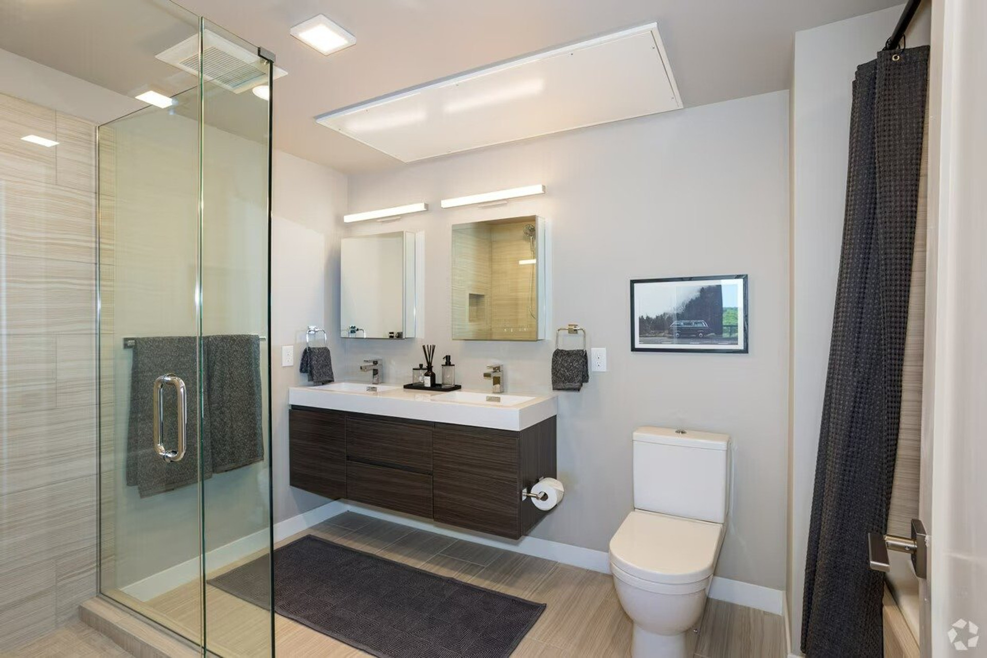 Bathroom with double vanity, glass shower