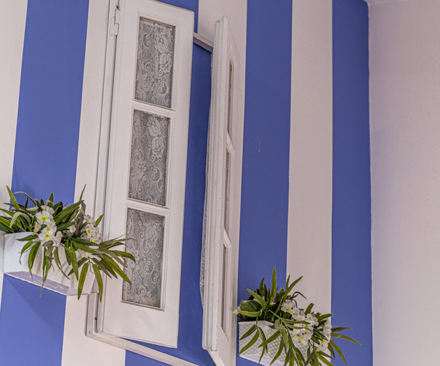 Striped wall with window shutters