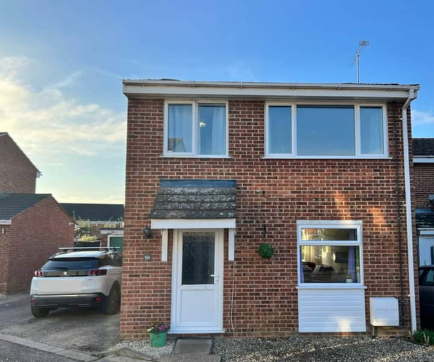 Front of house showing dedicated parking space to the left