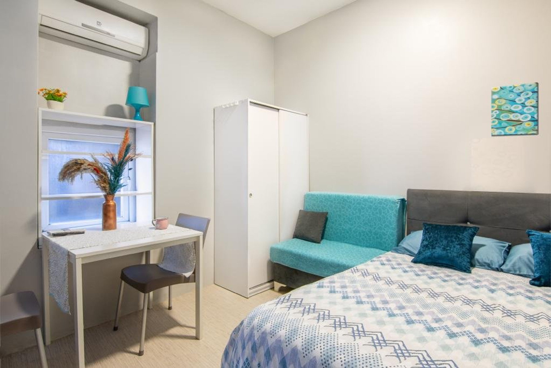 Bedroom area with desk and wardrobe