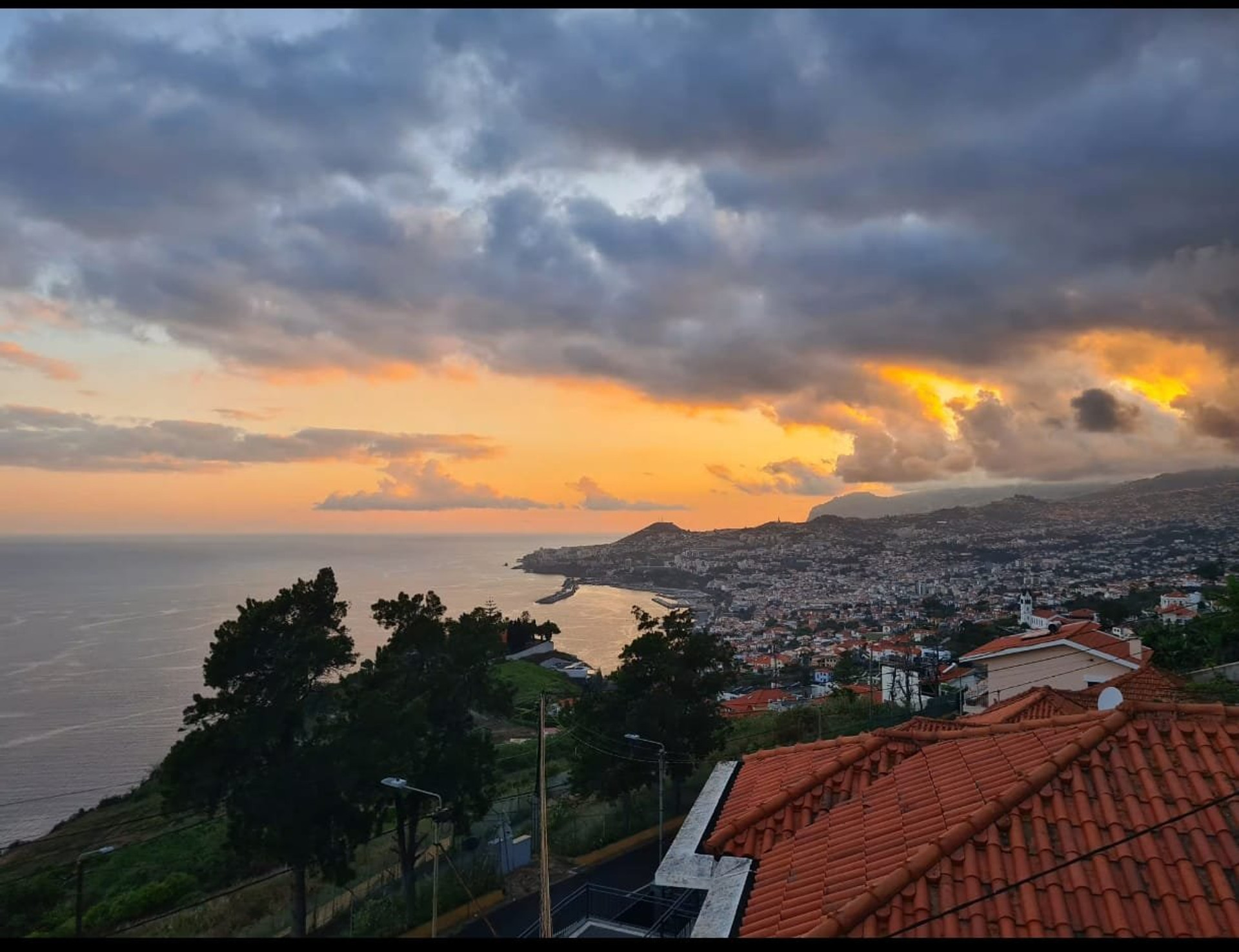Sunset panoramic city sea view from the terrace 