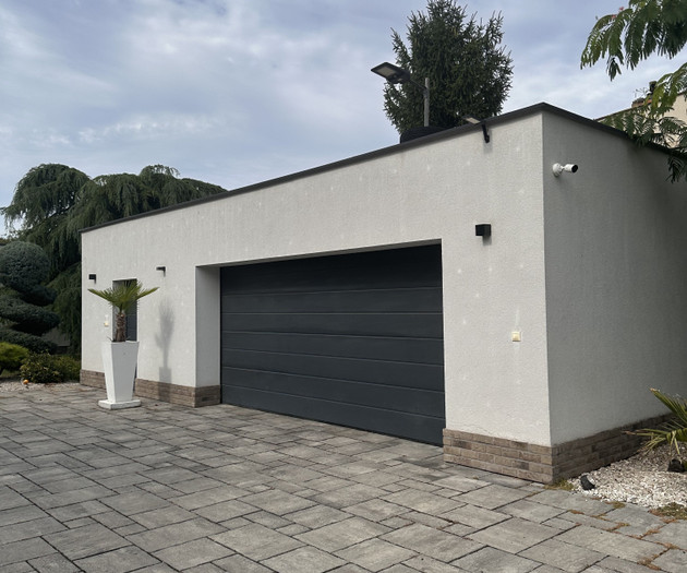 Side exterior with garage doors