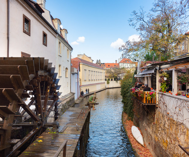 Canal view with wooden waterwheel