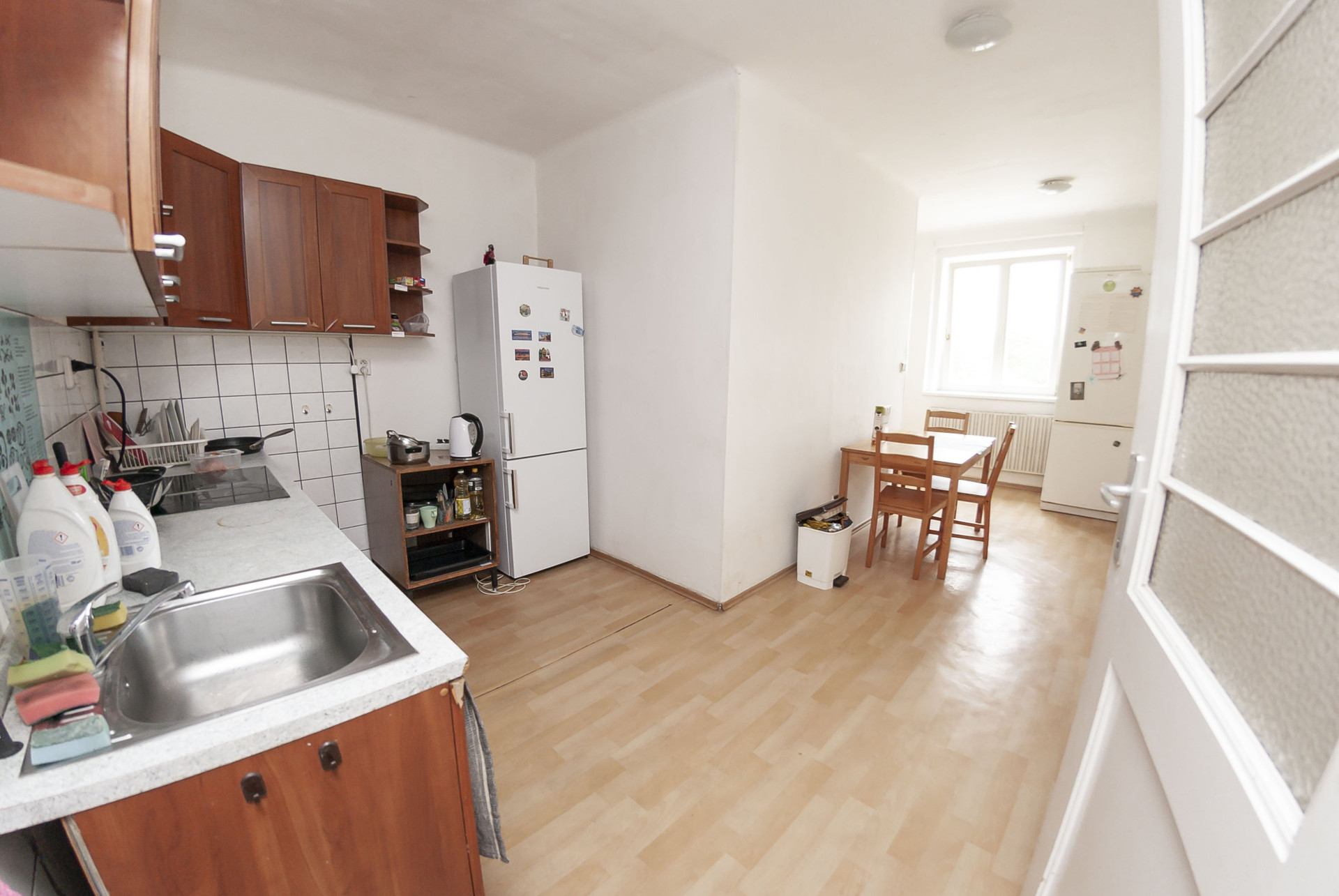 Kitchen with dining area and fridge