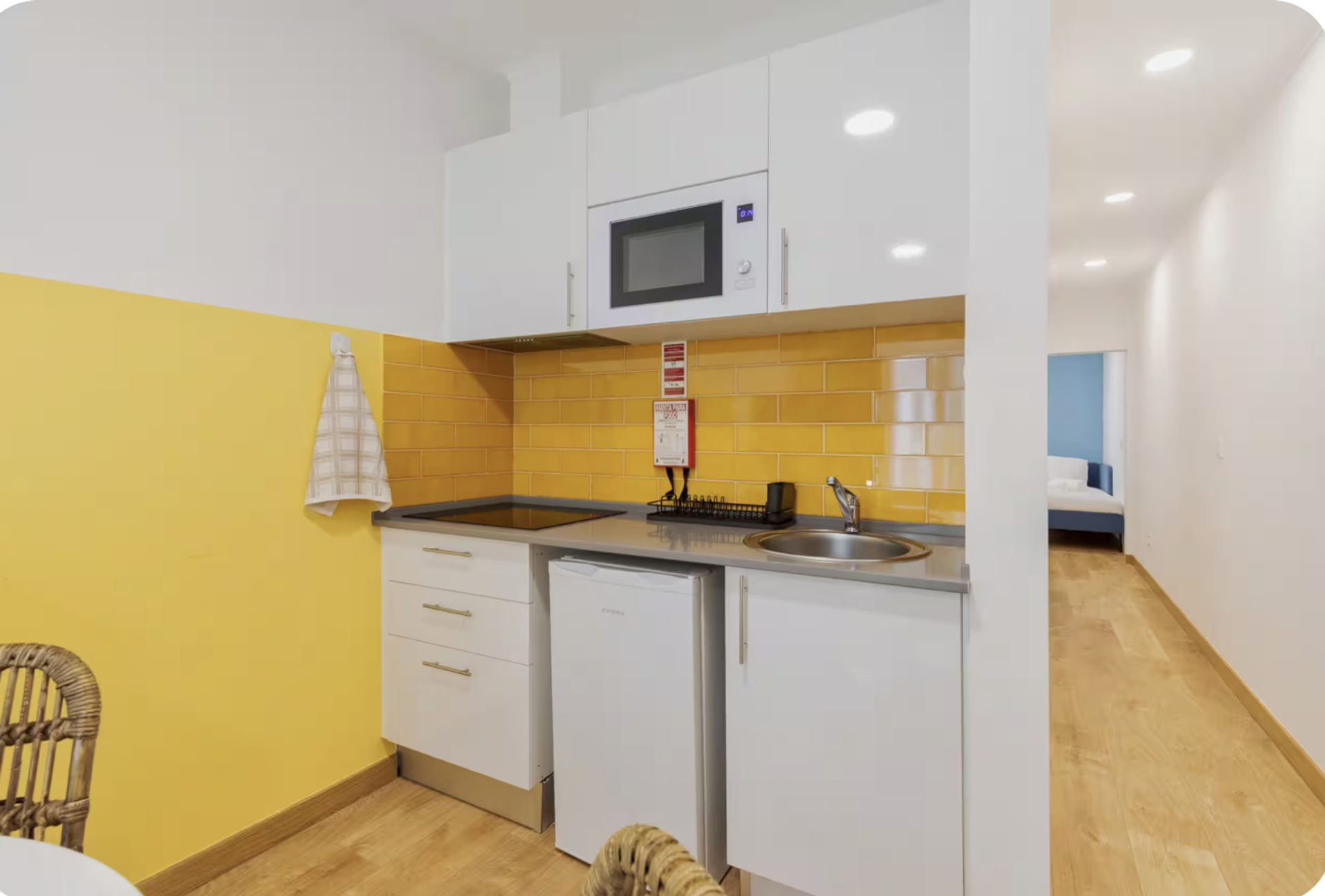 Compact kitchenette with hallway view