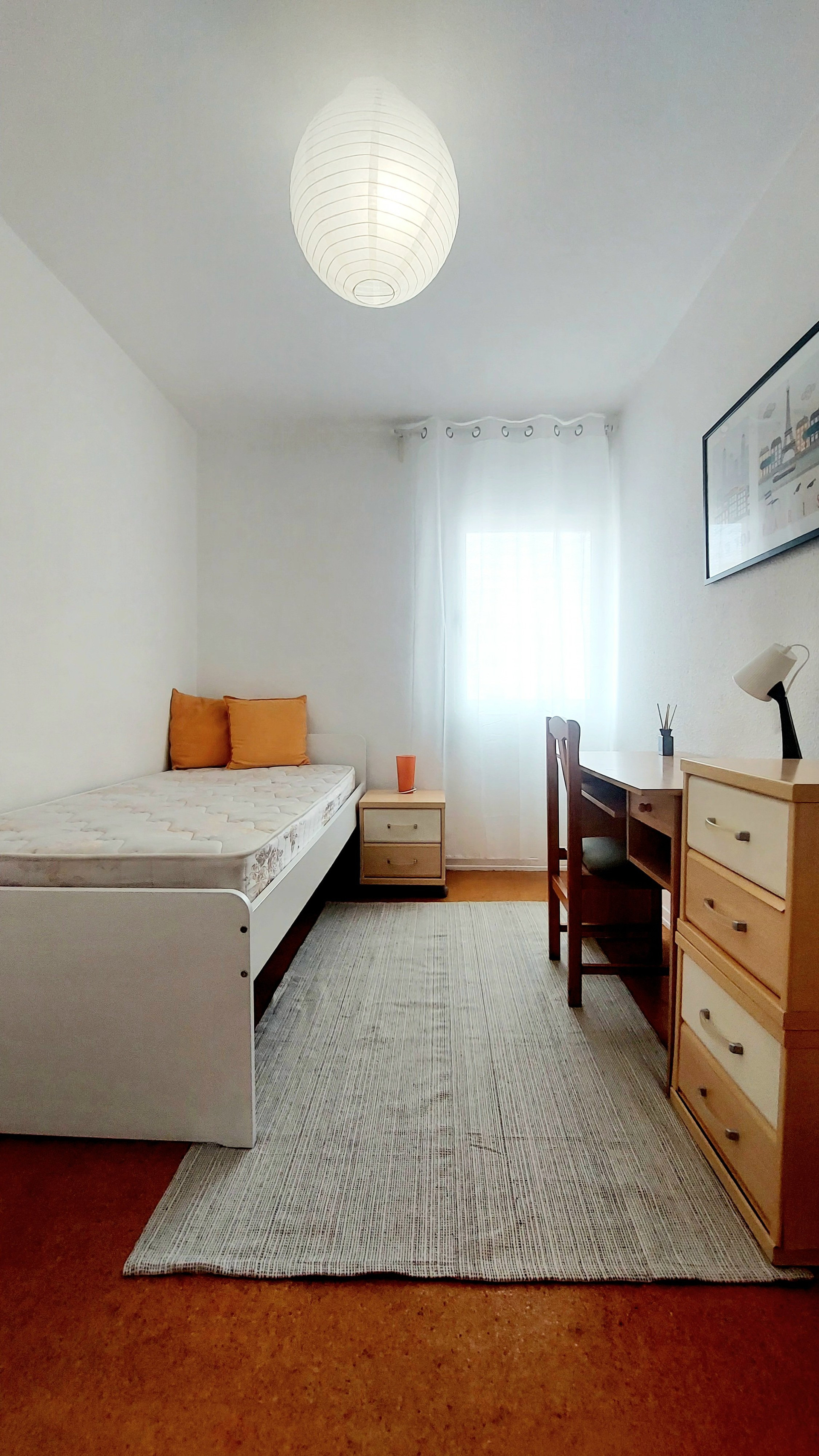 Single bedroom with desk and dresser