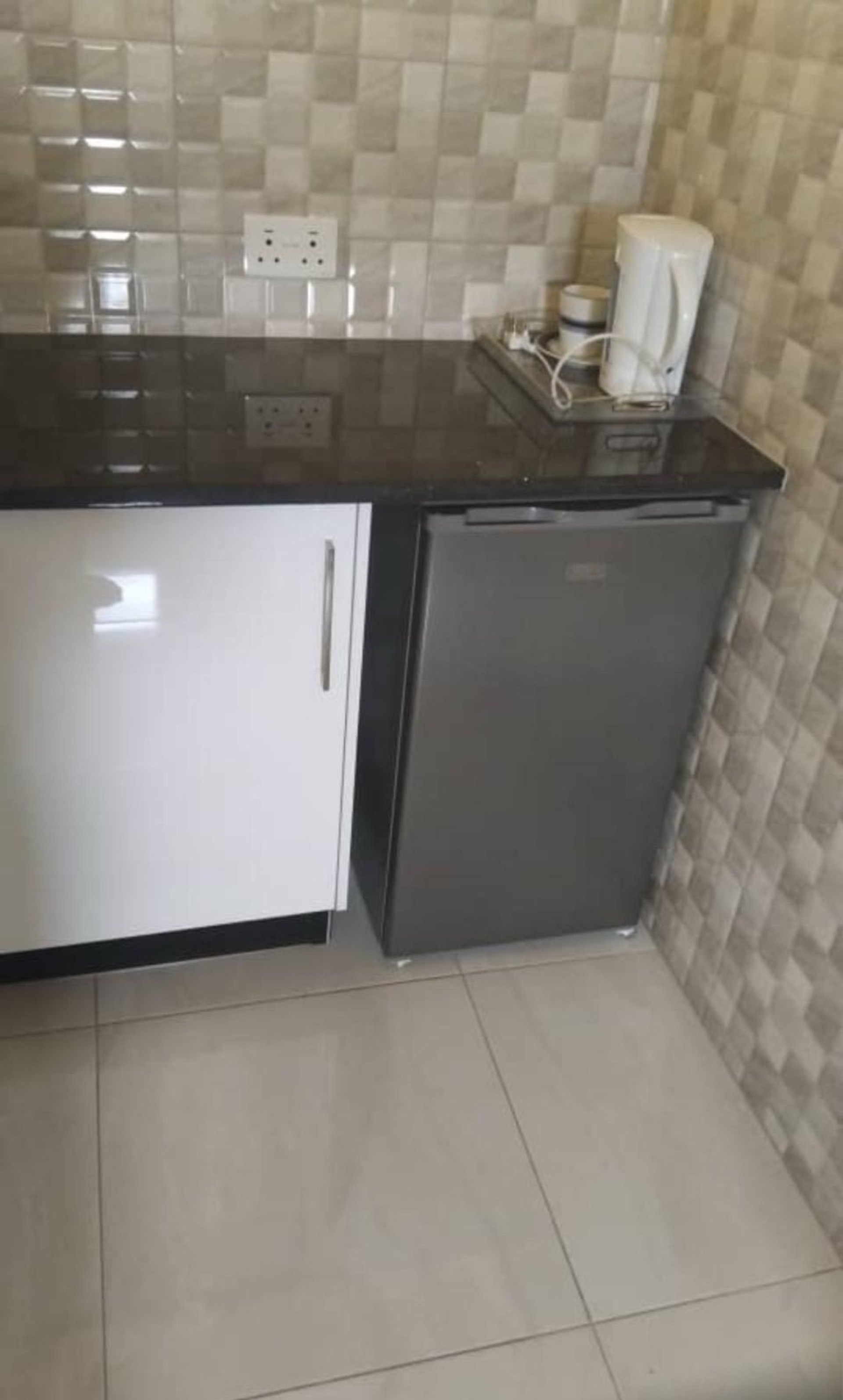 Small kitchenette with fridge