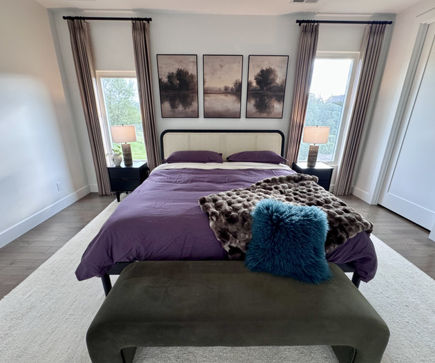 Purple-themed bedroom with art