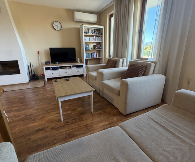 Living room with fireplace and sofa