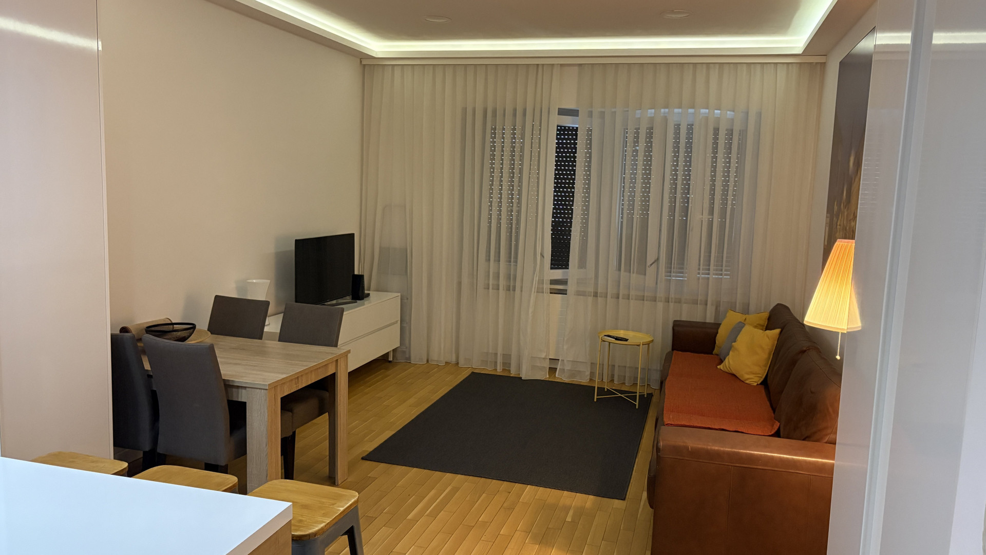 Living and dining area with sofa