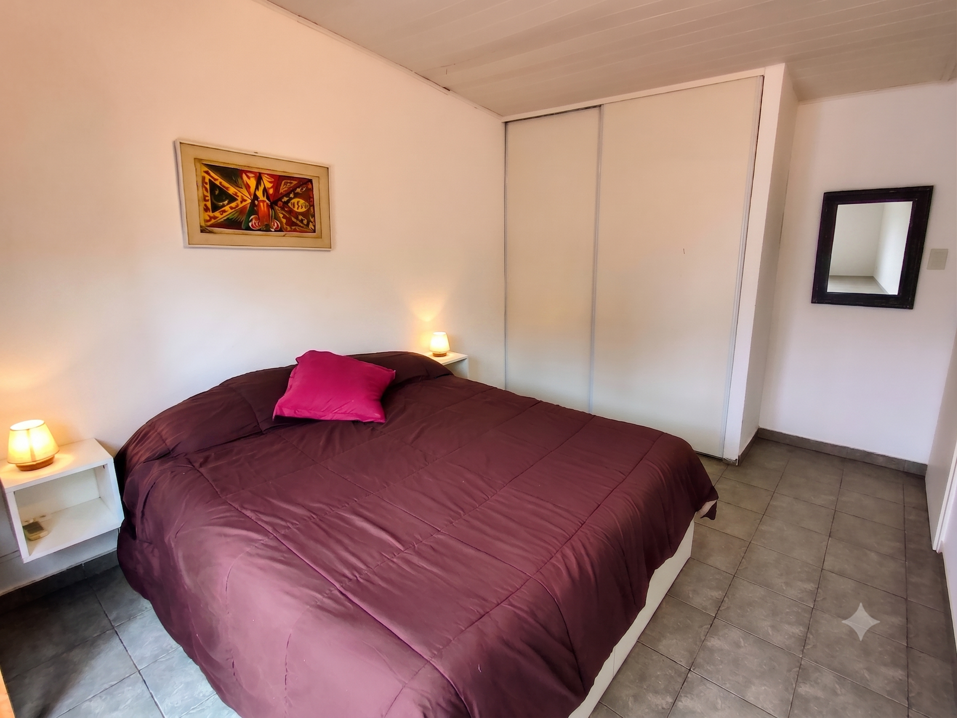 Bedroom with wardrobe and mirror