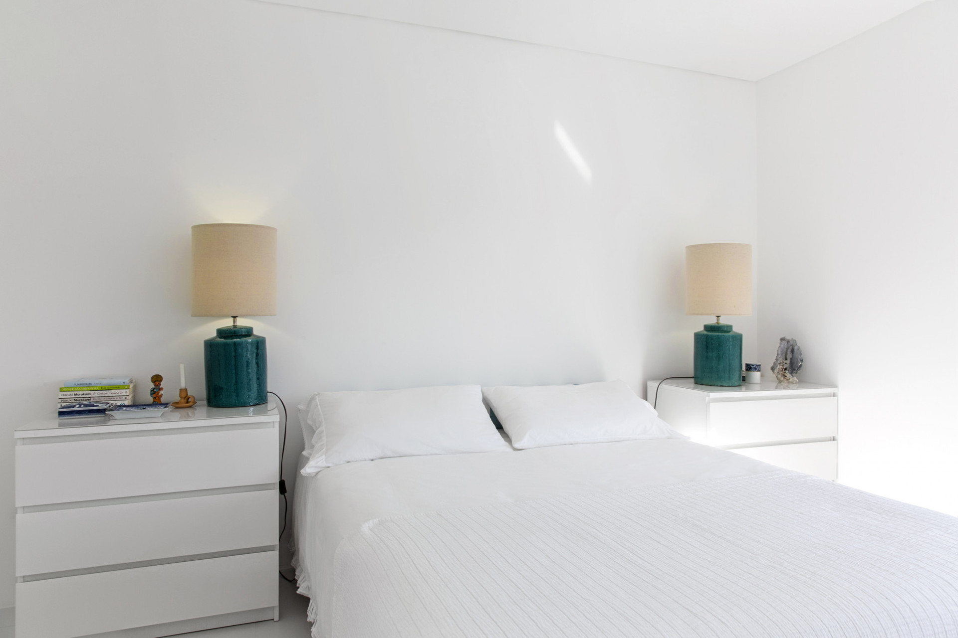 Bright bedroom with twin nightstands