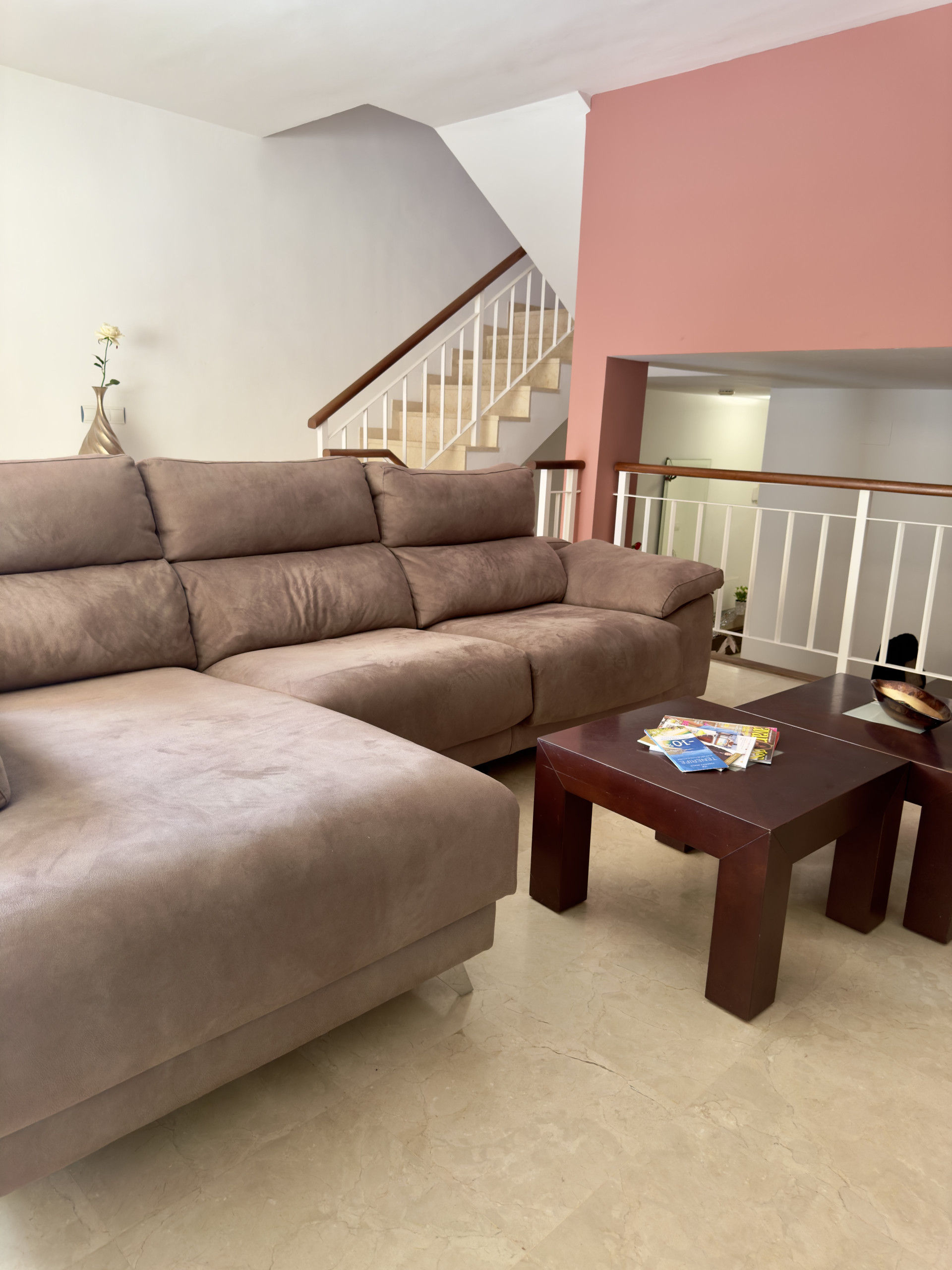 Spacious living room with staircase
