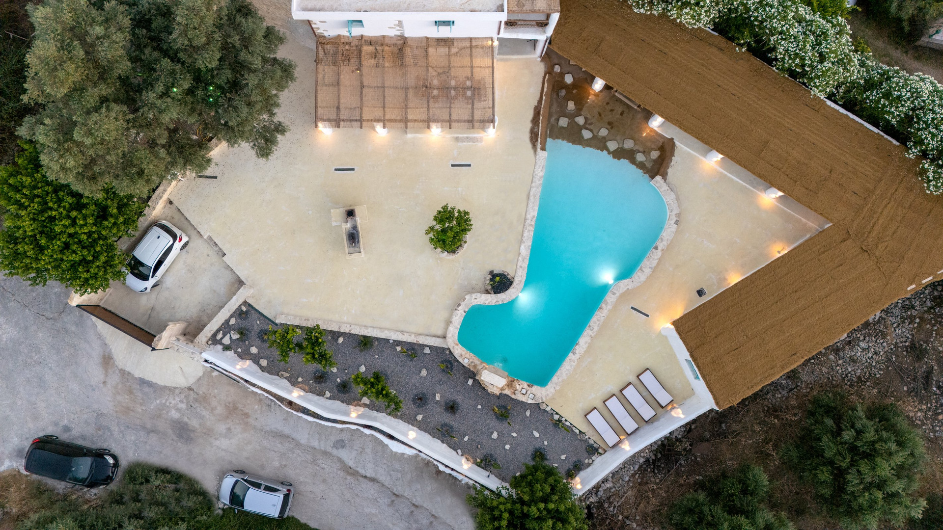 Aerial pool and courtyard at night