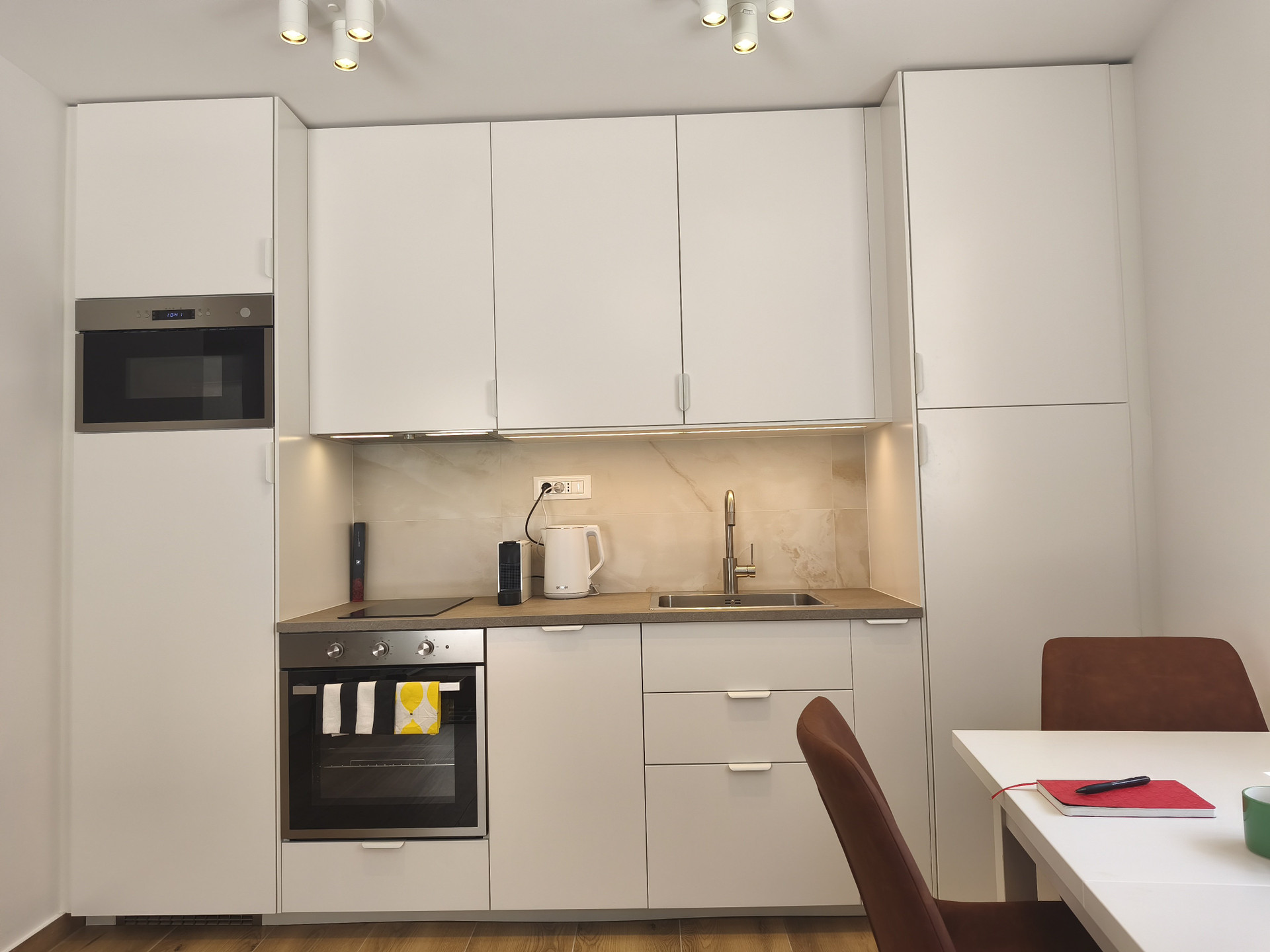 White kitchen cabinets with appliances