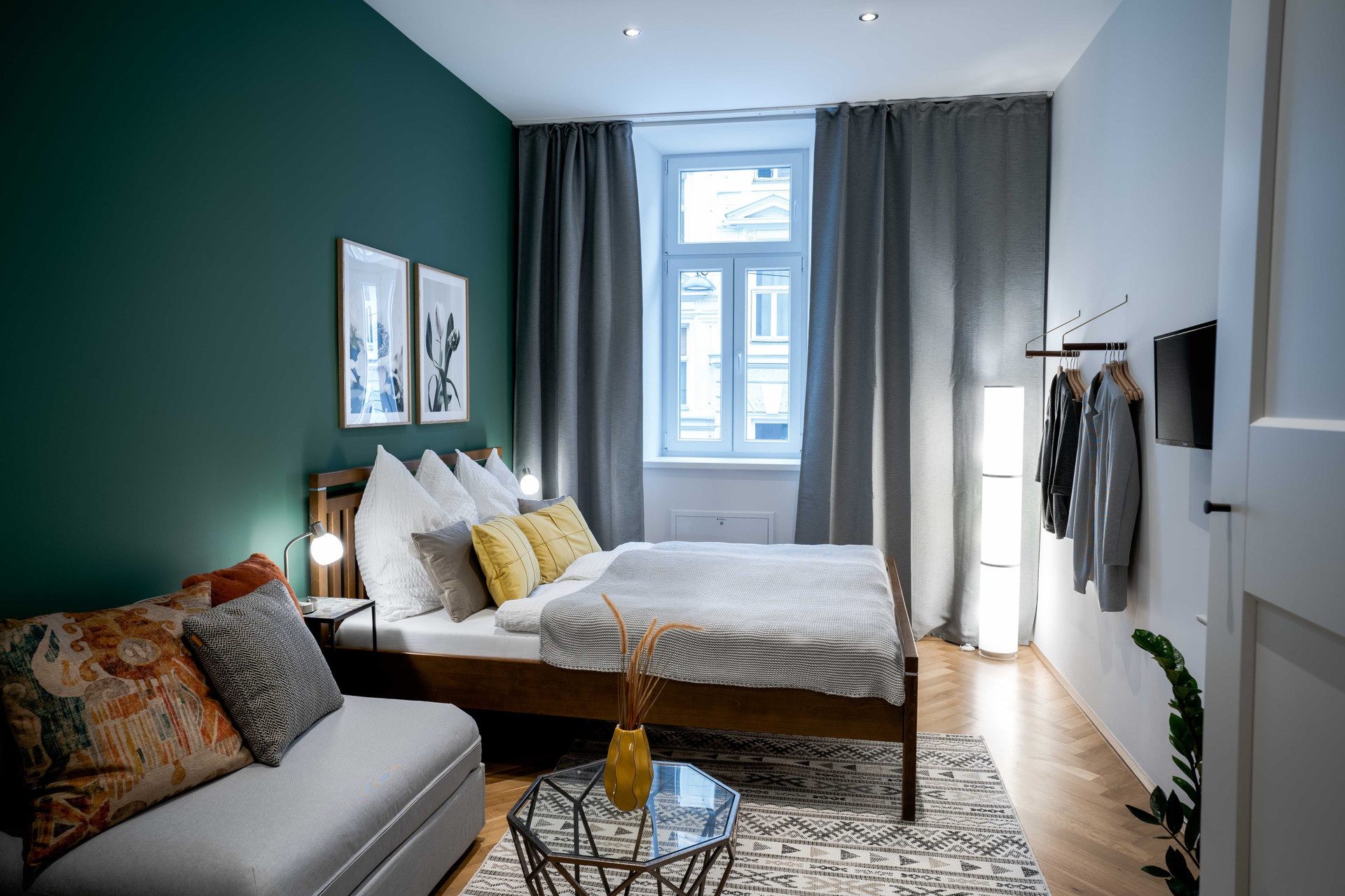 Bright bedroom with cosy bed and TV