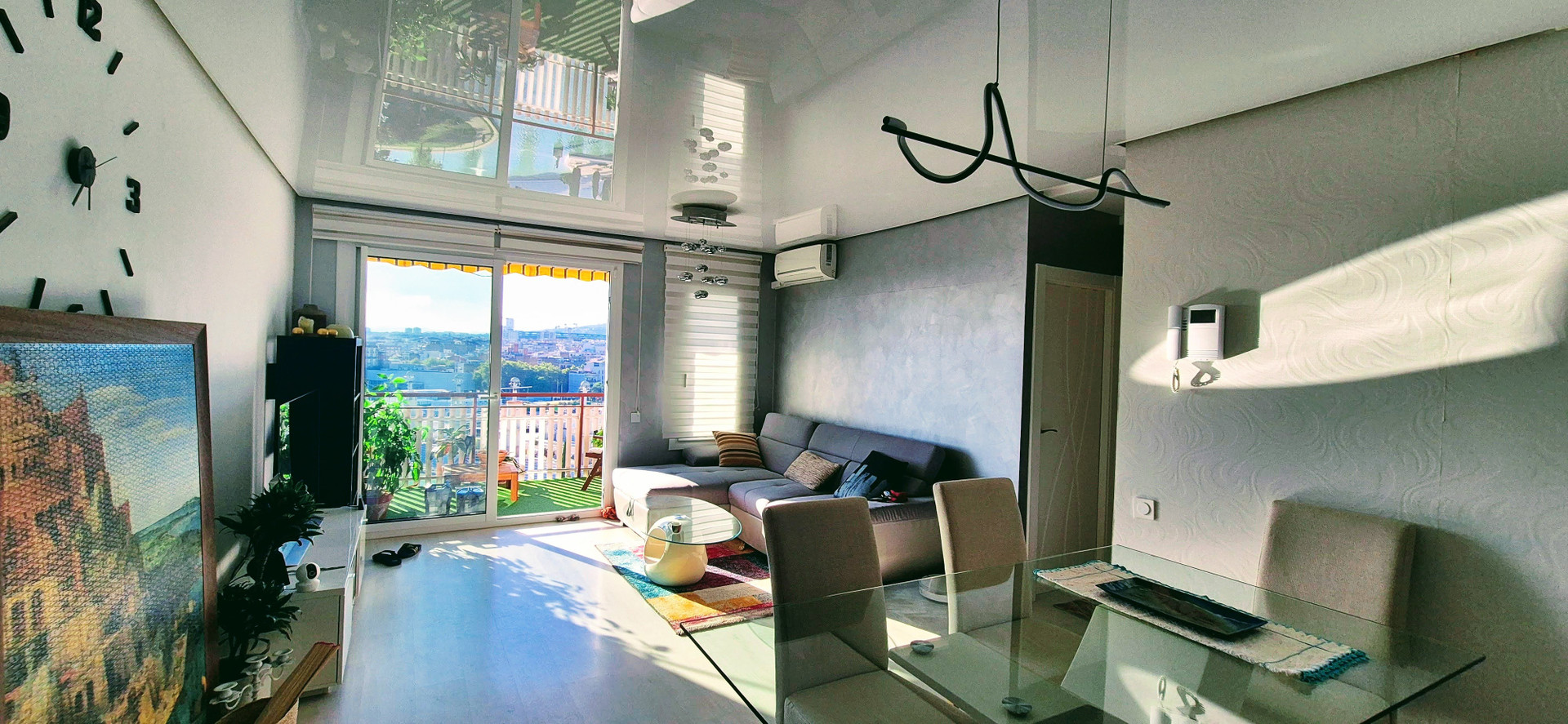 Bright living room with balcony access