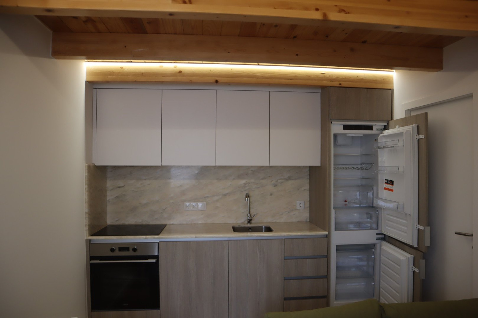 Kitchen with fridge and cabinets