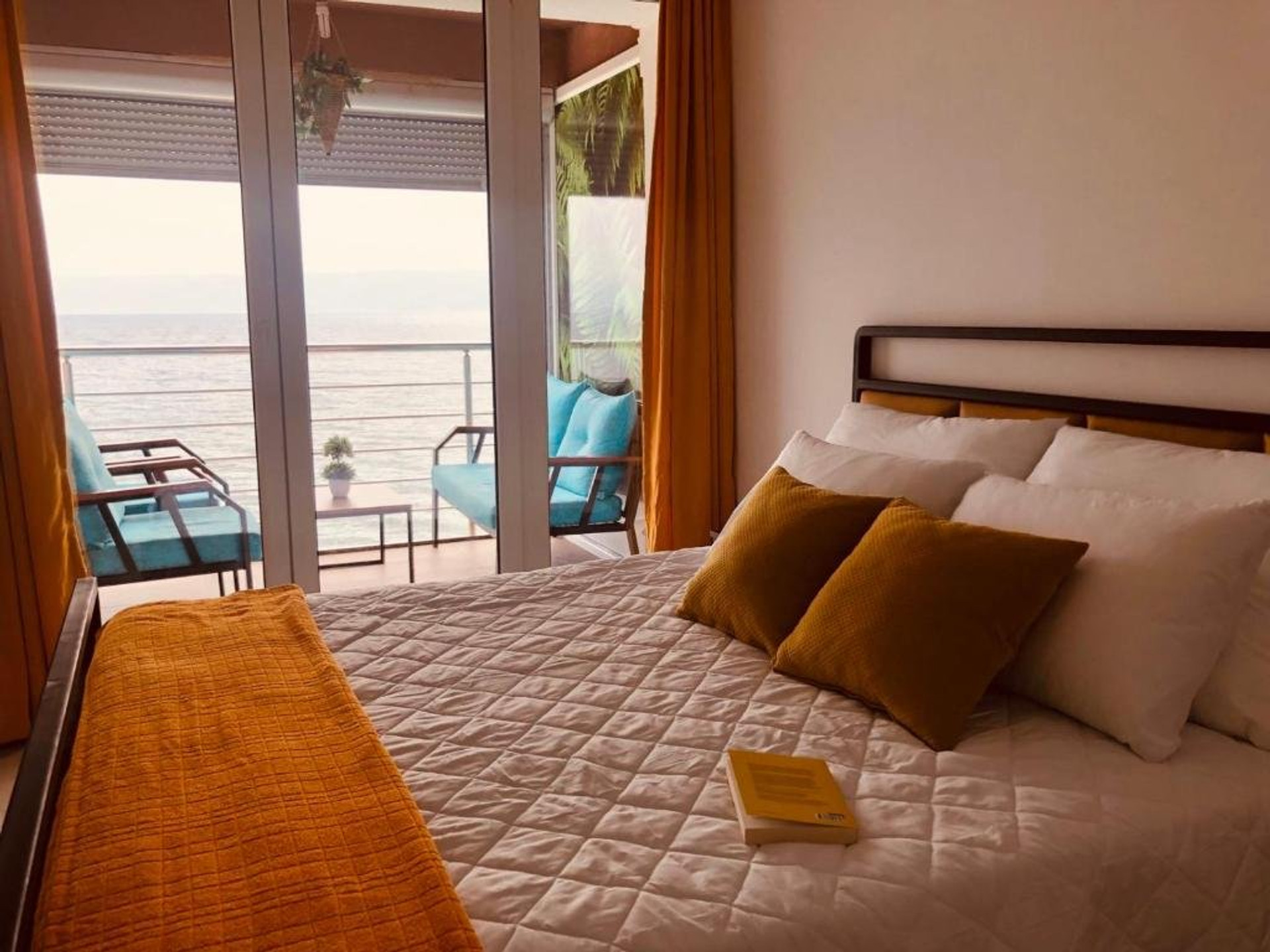 Bedroom with lake-view balcony