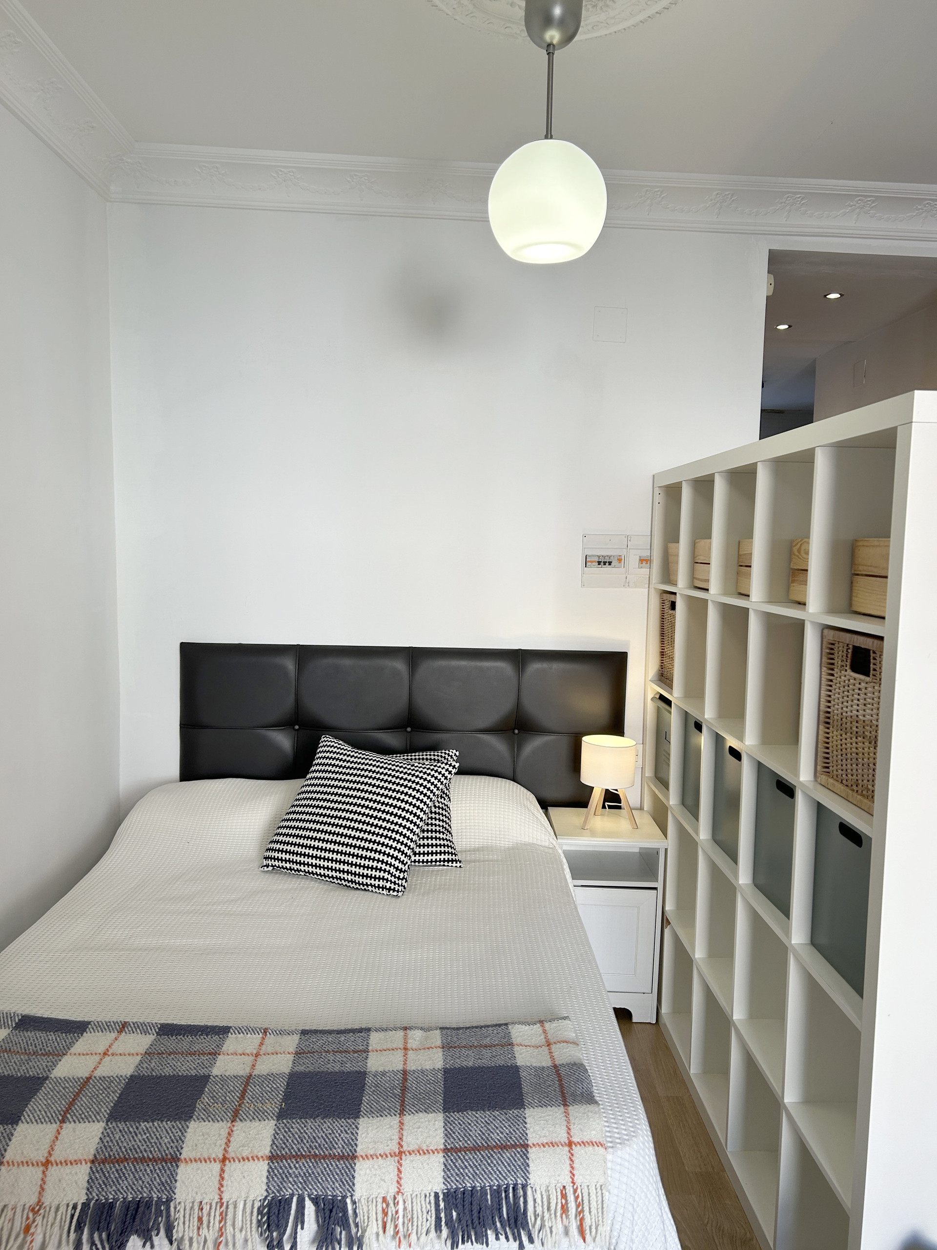 Bedroom area with shelving divider
